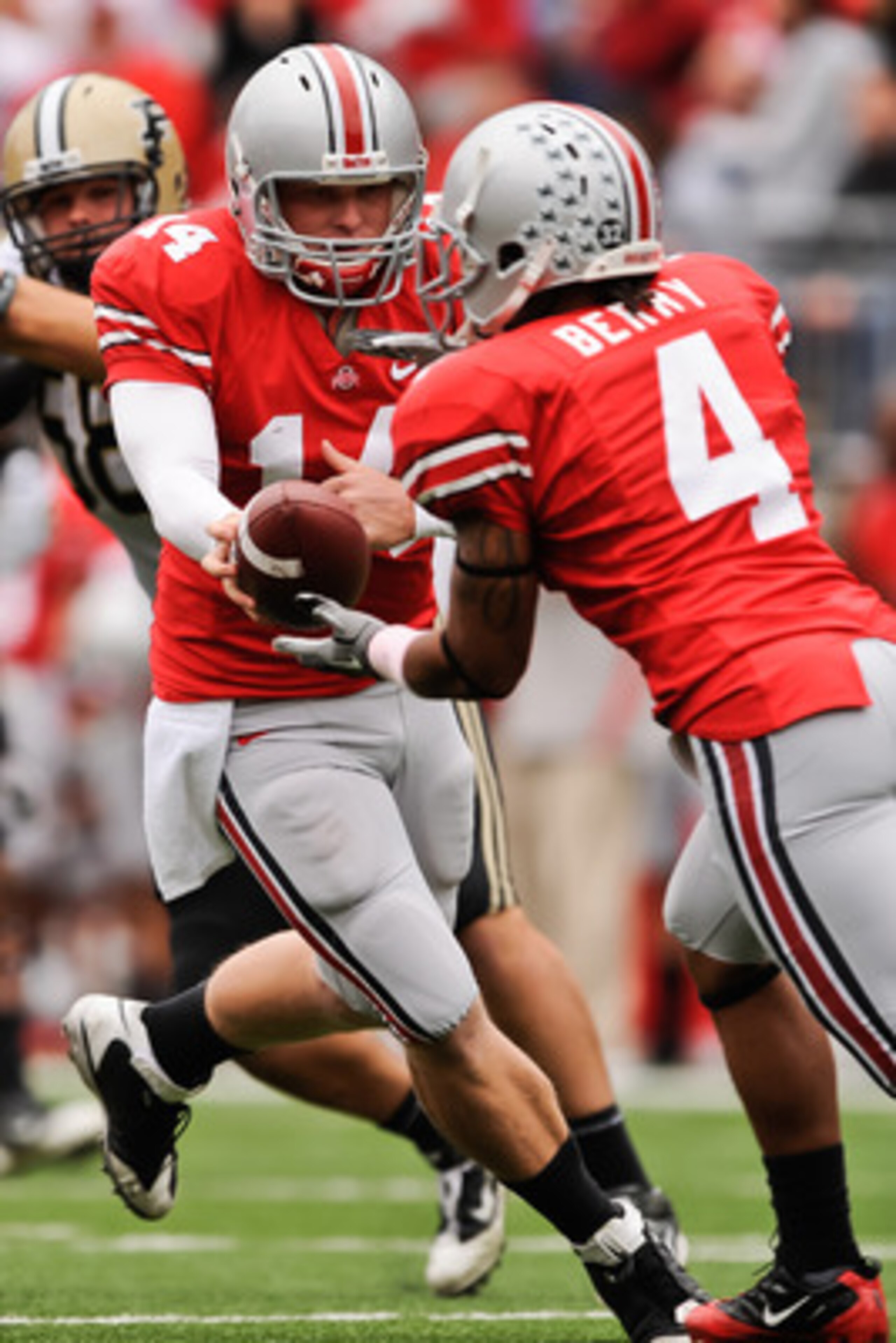 COLUMBUS, OH - OCTOBER 23: Joe Bauserman #14 of the Ohio State Buckeyes hands off the ball against the Purdue Boilermakers at Ohio Stadium on October 23, 2010 in Columbus, Ohio. (Photo by Jamie Sabau/Getty Images) COLUMBUS, OH - OCTOBER 23: Joe Bauserman #14 of the Ohio State Buckeyes hands off the ball against the Purdue Boilermakers at Ohio Stadium on October 23, 2010 in Columbus, Ohio. (Photo by Jamie Sabau/Getty Images)