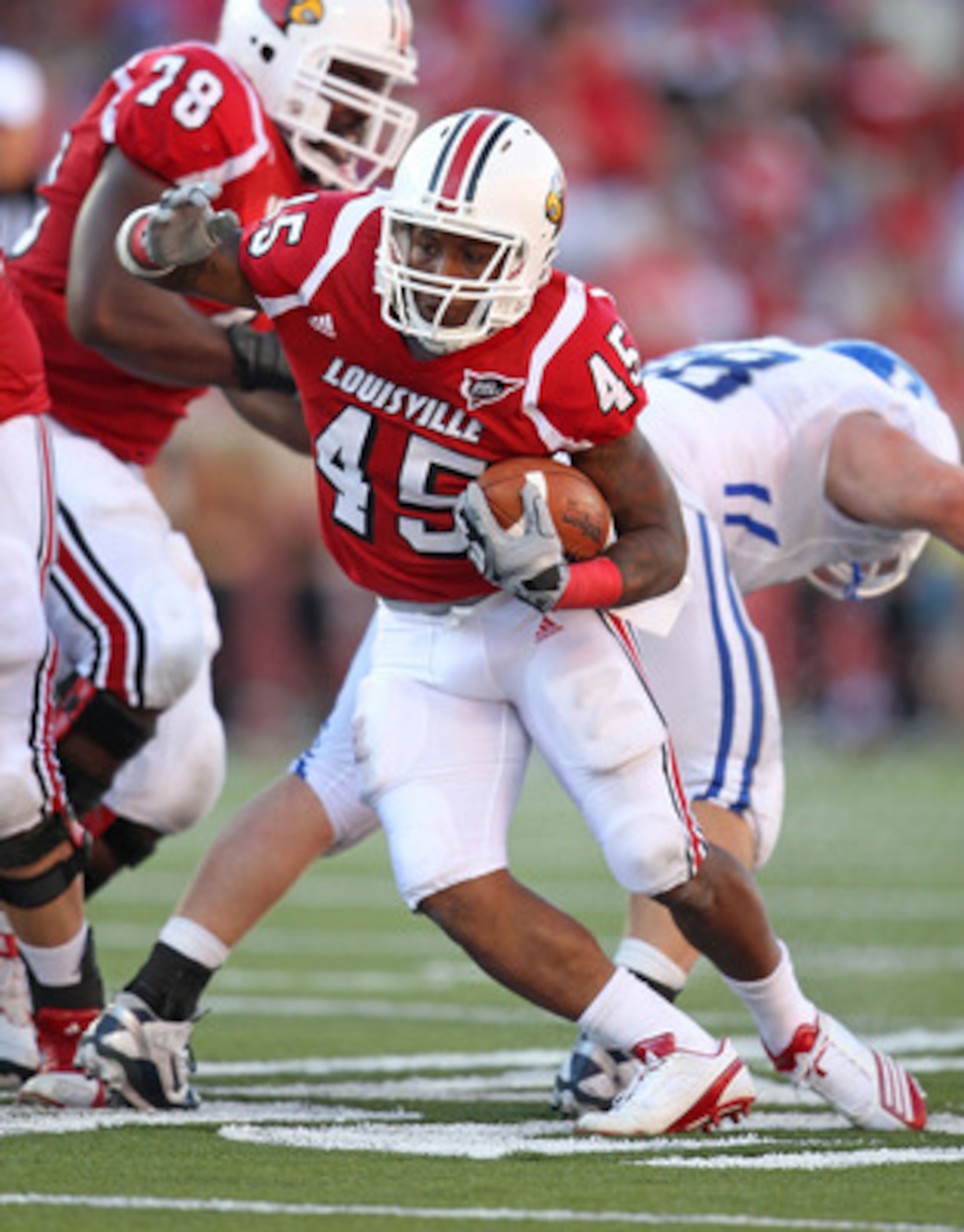 LOUISVILLE, KY - SEPTEMBER 04:  Blayne Donnell #45 of the Louisville Cardinals runs with the ball during the game against the Kentucky Wildcats at Papa John's Cardinal Stadium on September 4, 2010 in Louisville, Kentucky.  (Photo by Andy Lyons/Getty Image