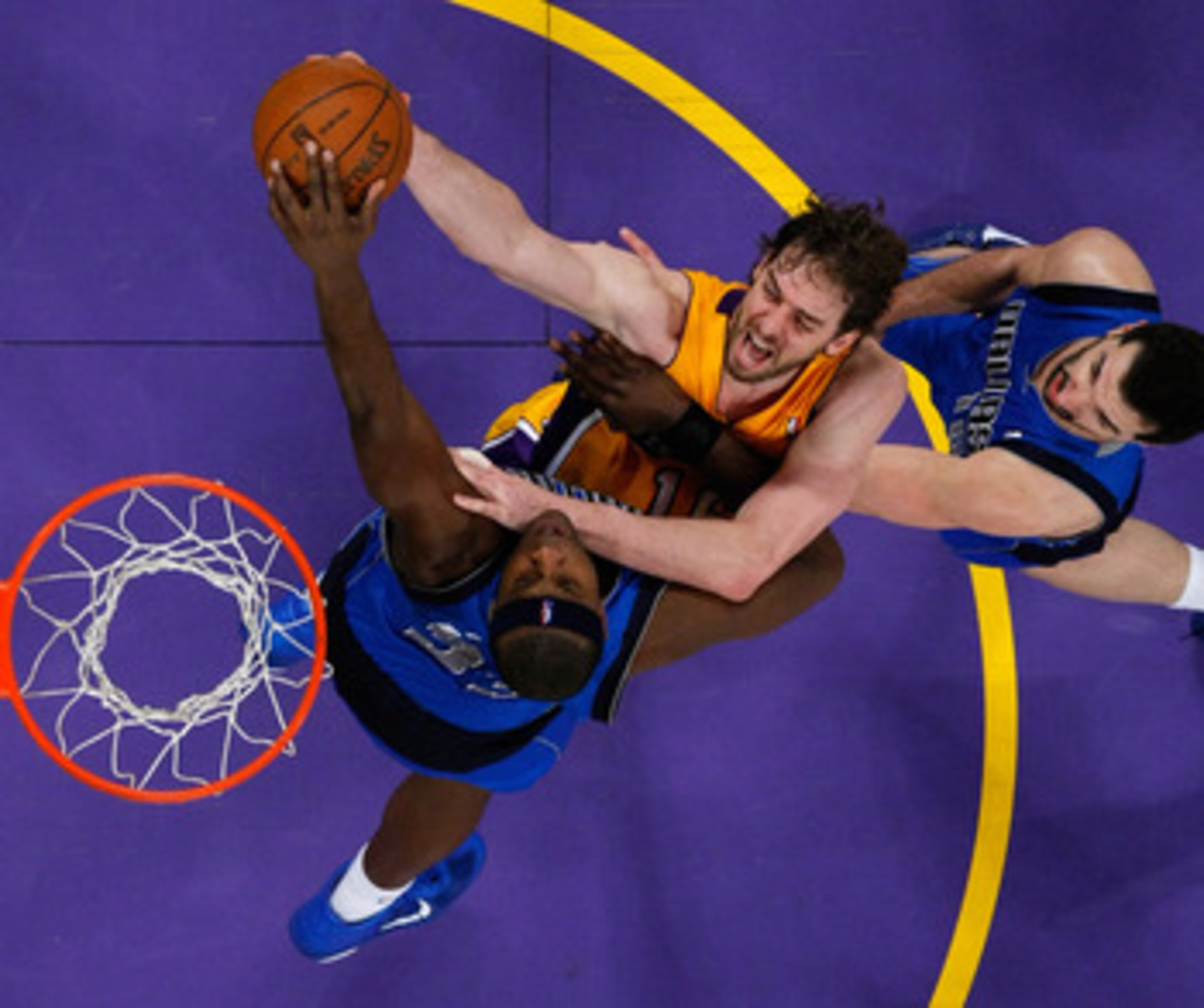 LOS ANGELES, CA - MAY 04:  Pau Gasol #16 of the Los Angeles Lakers goes up for a shot as Brendan Haywood #33 of the Dallas Mavericks goes for the block in Game Two of the Western Conference Semifinals in the 2011 NBA Playoffs at Staples Center on May 4, 2