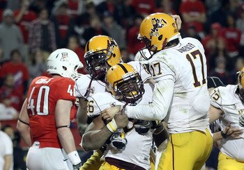 TUCSON, AZ - DECEMBER 02:  Quarterback Brock Osweiler #17 of the Arizona State Sun Devils celebrates with Cameron Marshall #26 after he scored a rushing touchdown against the Arizona Wildcats during the double overtime of the college football game at Ariz