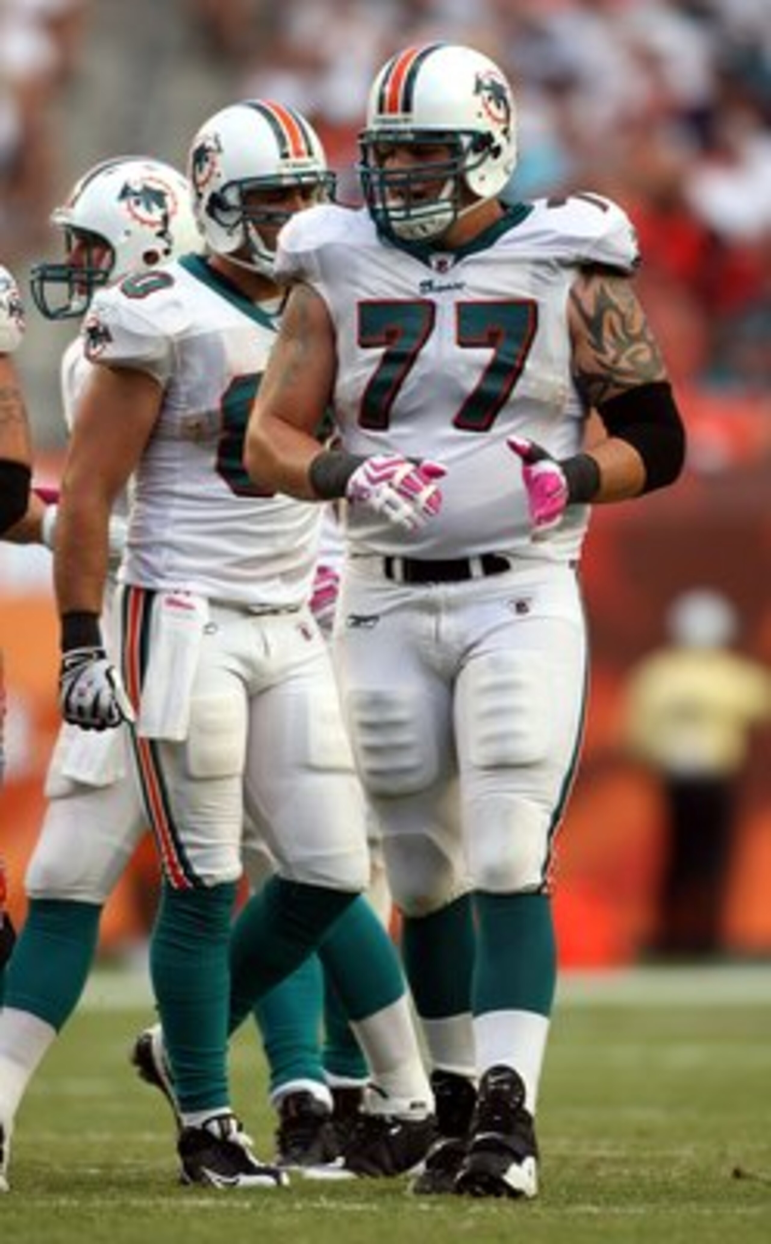 MIAMI - OCTOBER 04:  Lineman Jake Long #77 of the Miami Dolphins looks on against the Buffalo Bills at Land Shark Stadium on October 4, 2009 in Miami, Florida. Miami defeated Buffalo 31-30.  (Photo by Marc Serota/Getty Images)