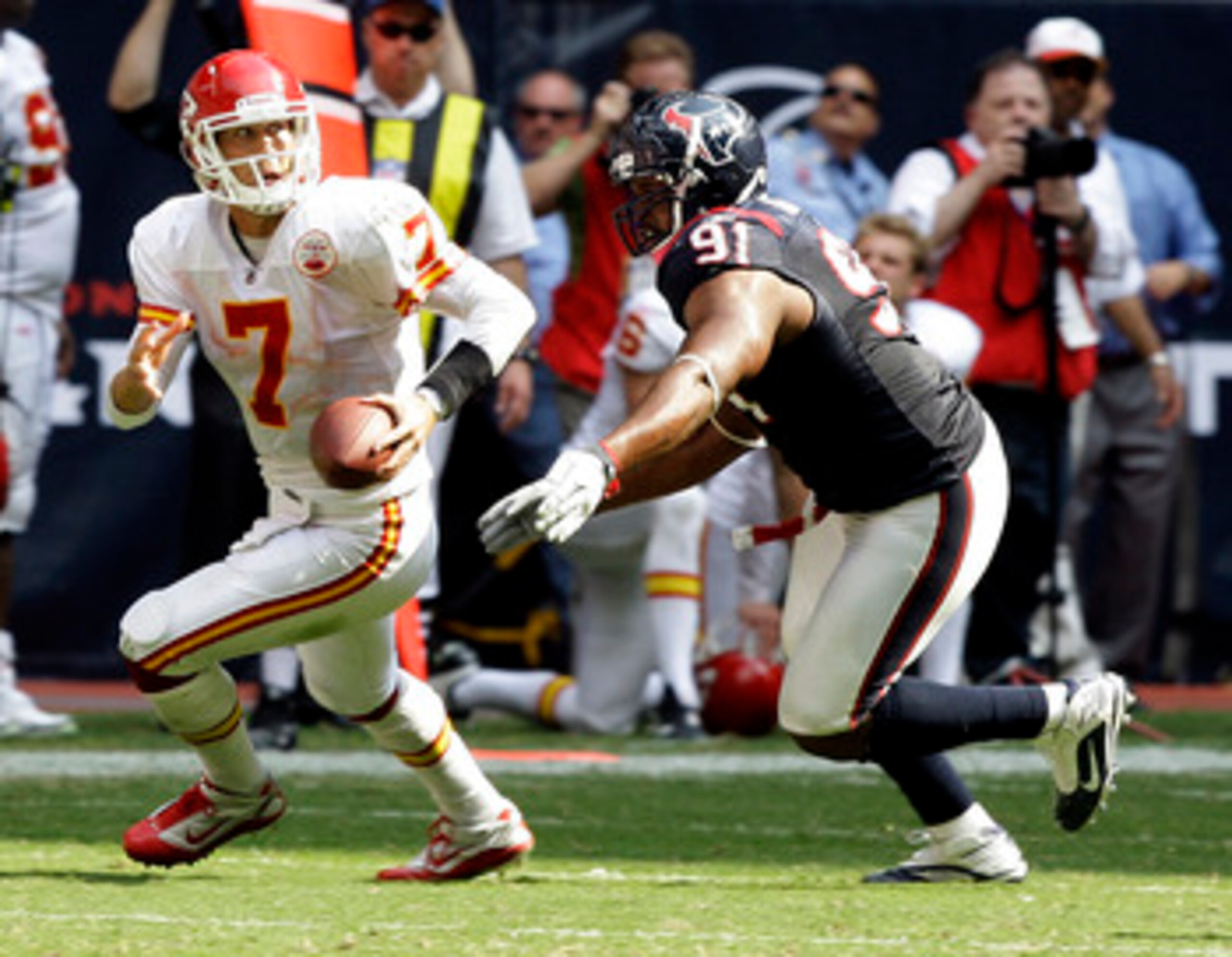 HOUSTON - OCTOBER 17:  Defensive tackle Amobi Akoye #91 of the Houston Texans sacks quarterback Matt Cassel of the Kansas City Chiefs on the final play of the game to secure a 35-31 win at Reliant Stadium on October 17, 2010 in Houston, Texas.  (Photo by