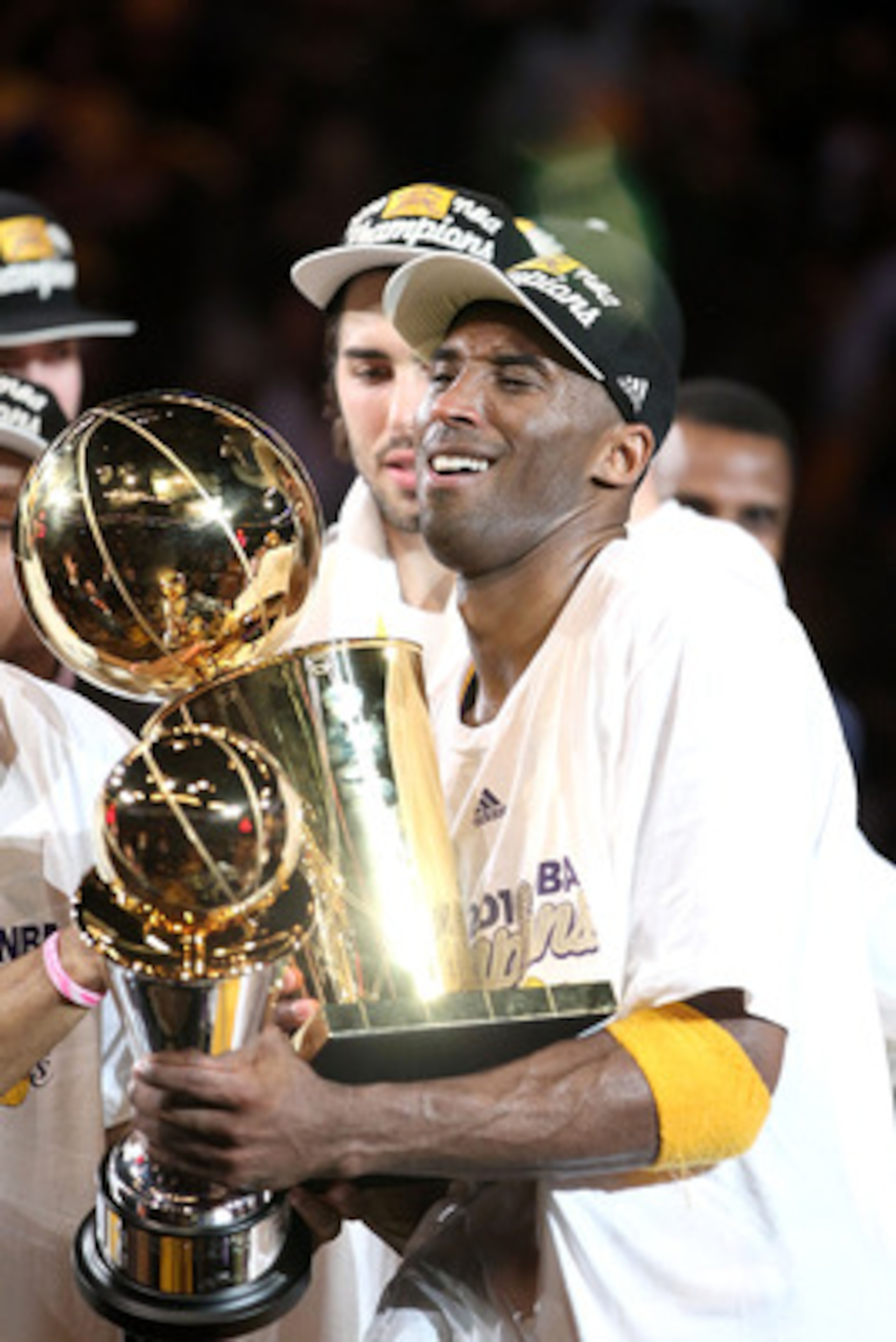 LOS ANGELES, CA - JUNE 17:  Kobe Bryant #24 of the Los Angeles Lakers struggles to hold both the Larry O'Brien trophy and the MVP trophy after the Lakers defeated the Boston Celtics in Game Seven of the 2010 NBA Finals at Staples Center on June 17, 2010 i