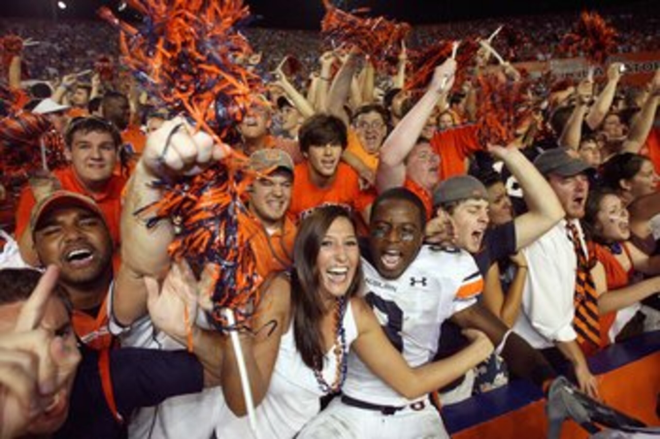GAINESVILLE, FL - SEPTEMBER 29: Jerraud Powers #8 of the Auburn Tigers jumps into the stands and celebrates with fans after defeating the Florida Gators at Ben Hill Griffin Stadium September 29, 2007 in Gainesville, Florida. (Photo by Doug Benc/Getty Imag