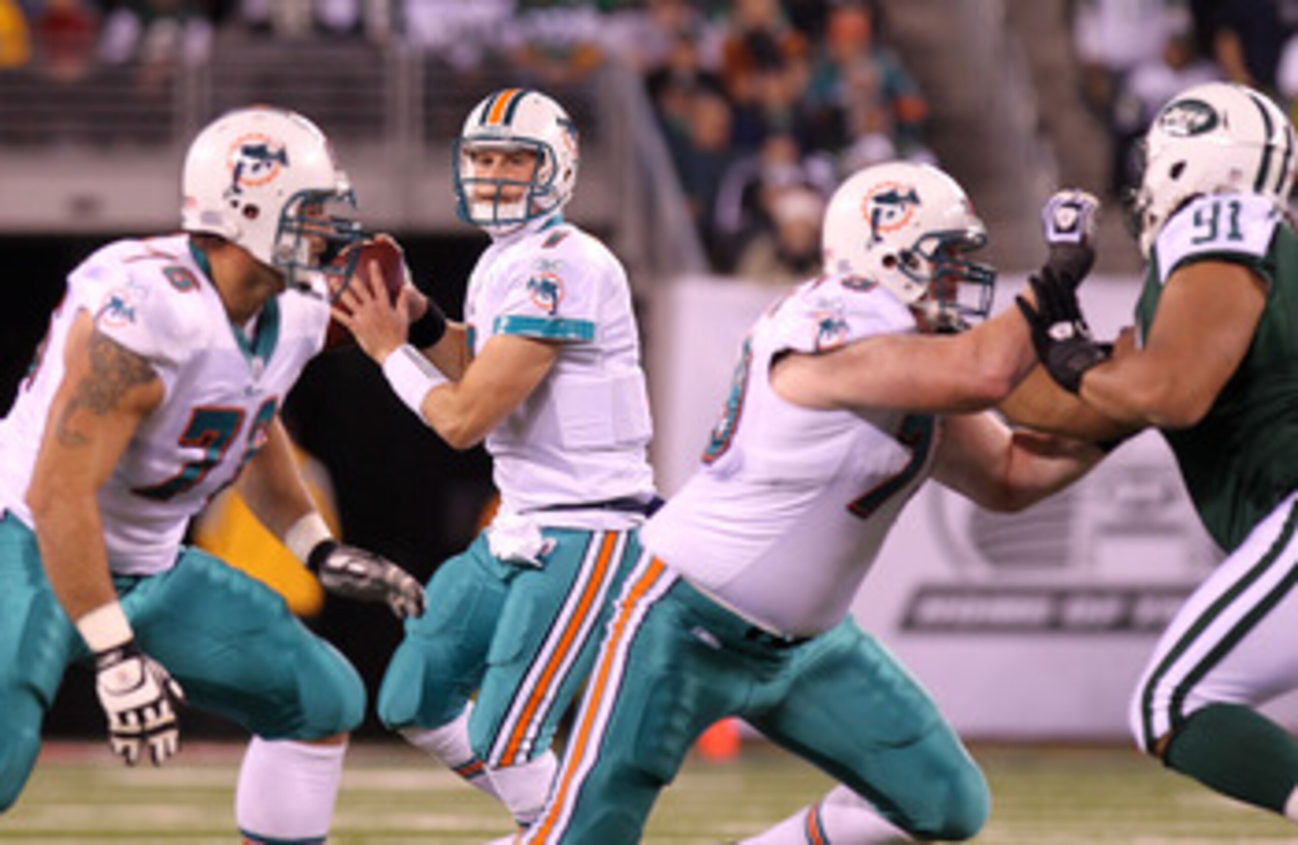 EAST RUTHERFORD, NJ - DECEMBER 12:  Chad Henne #7 of the Miami Dolphins drops back to pass against the New York Jets at New Meadowlands Stadium on December 12, 2010 in East Rutherford, New Jersey.  (Photo by Nick Laham/Getty Images)
