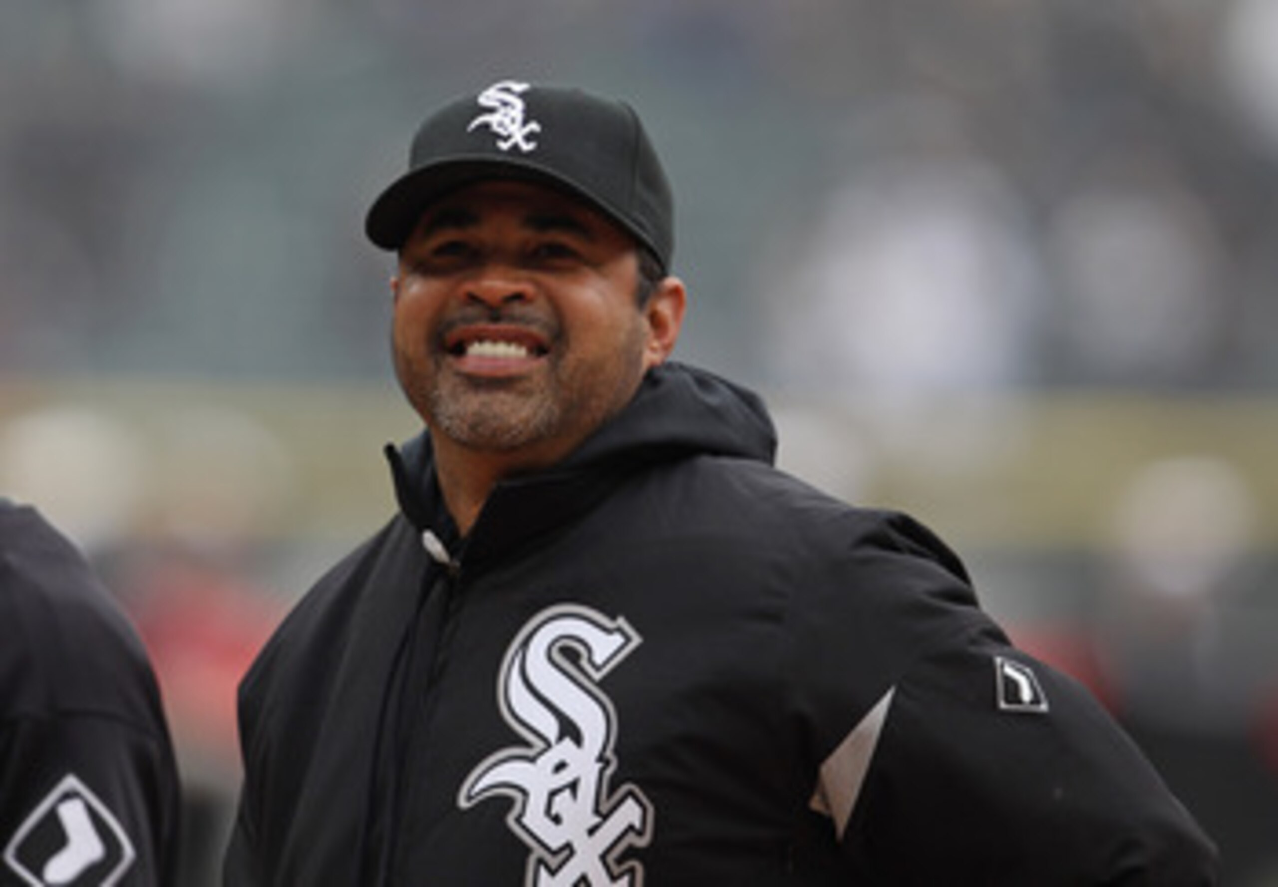 CHICAGO, IL - APRIL 07: Manager Ozzie Guillen #13 of the Chicago White Sox smiles at fans before the home opener against the Tampa Bay Rays at U.S. Cellular Field on April 7, 2011 in Chicago, Illinois. The White Sox defeated the Rays 5-1. (Photo by Jonath