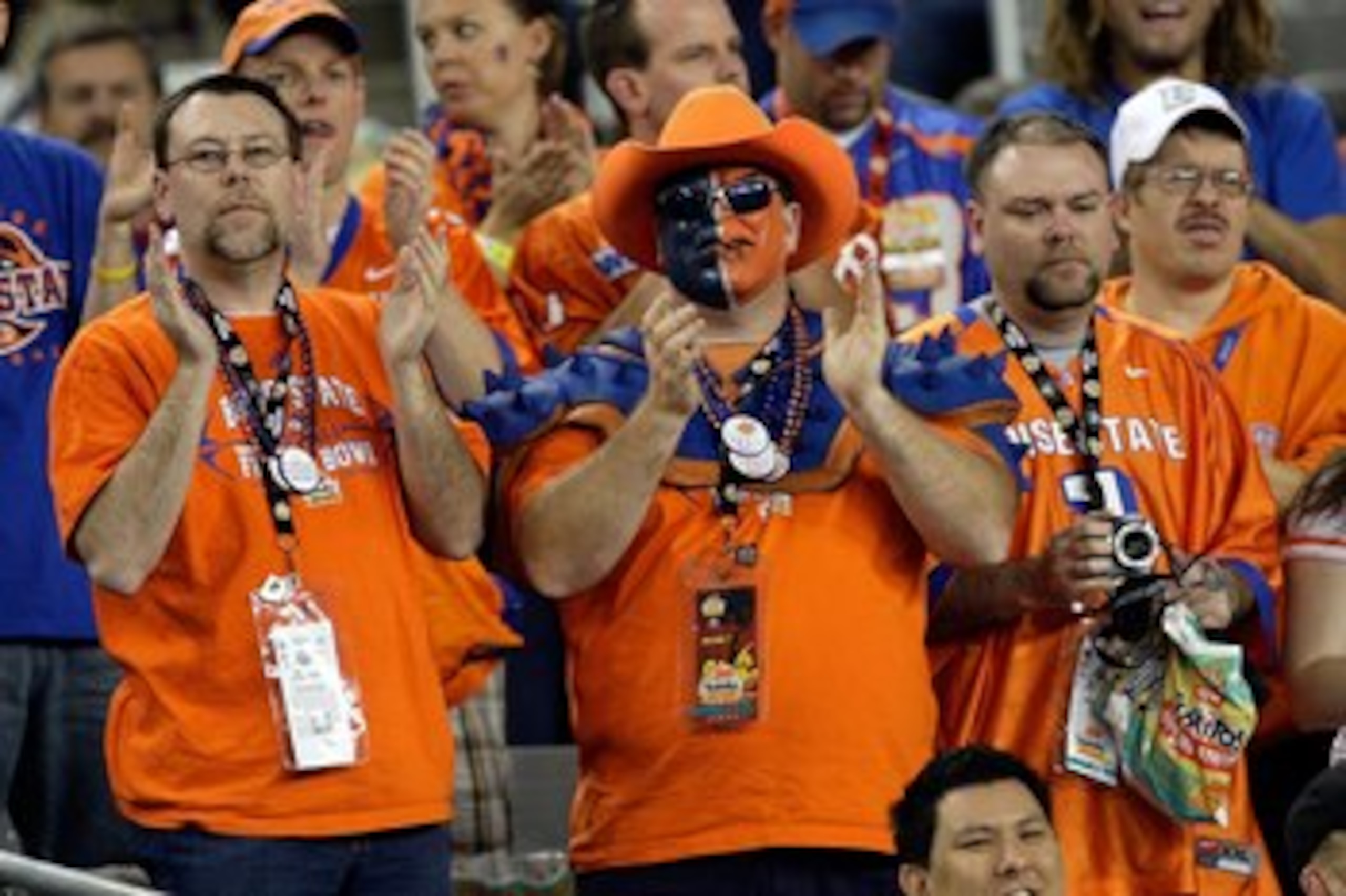 GLENDALE, AZ - JANUARY 04:  The Boise State Broncos fans cheer on the Broncos in the first half against the TCU Horned Frogs during the Tostitos Fiesta Bowl at the Universtity of Phoenix Stadium on January 4, 2010 in Glendale, Arizona.  (Photo by Jamie Sq