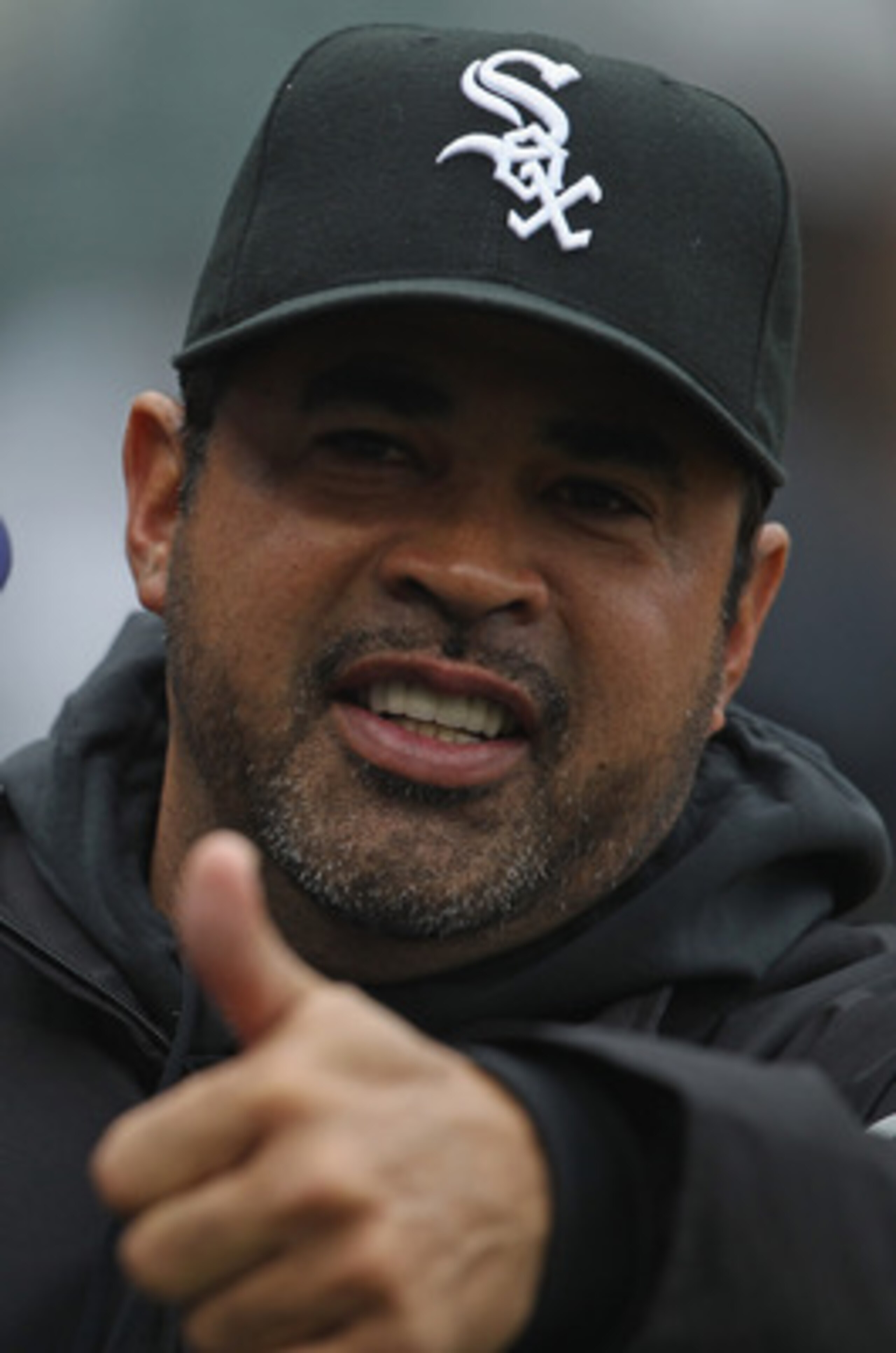 CHICAGO, IL - APRIL 07: Manager Ozzie Guillen #13 of the Chicago White Sox gives a 'thumbs up' to members of the Tampa Bay Rays before the home opener at U.S. Cellular Field on April 7, 2011 in Chicago, Illinois. (Photo by Jonathan Daniel/Getty Images)