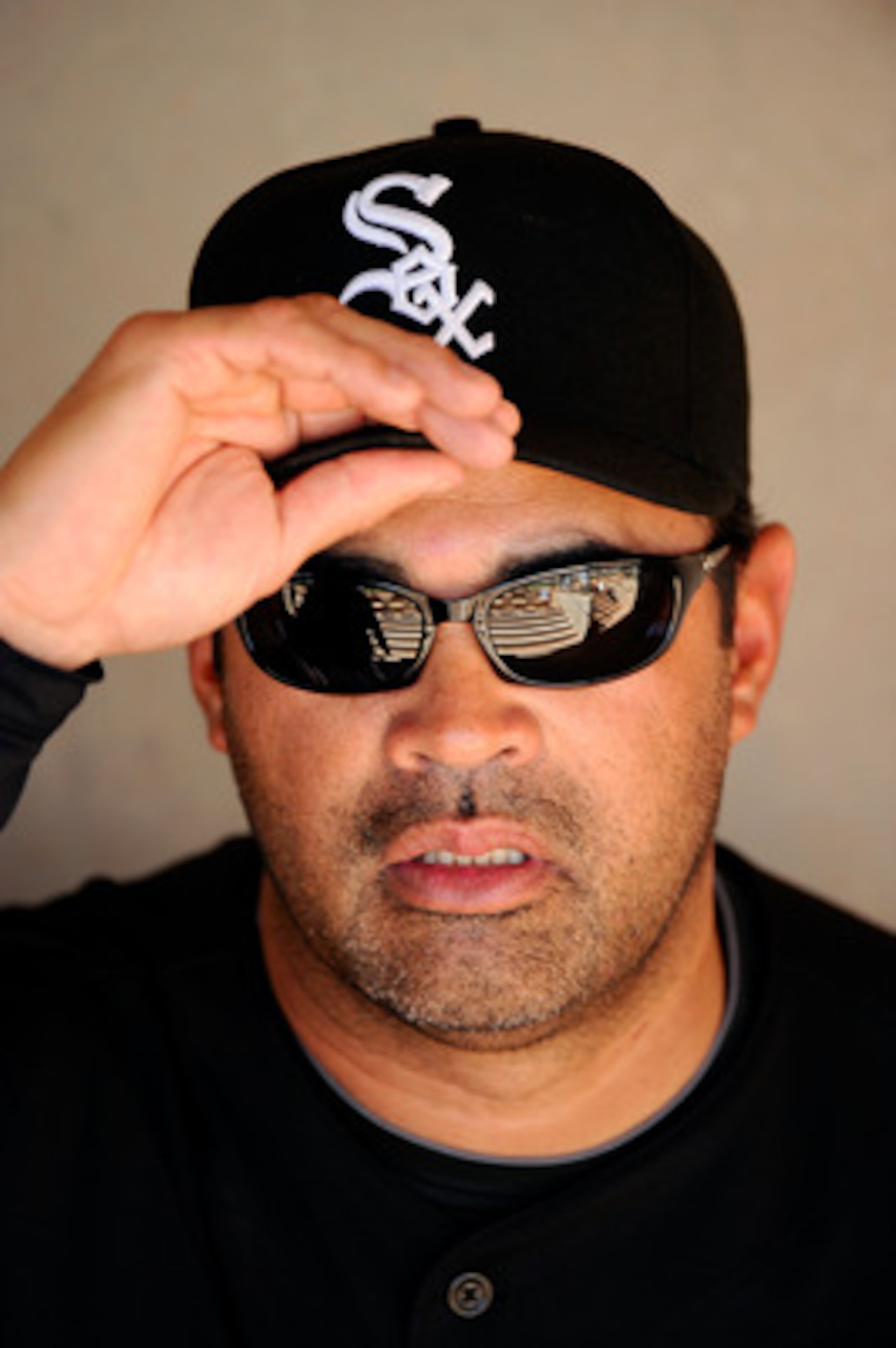 GLENDALE, AZ - MARCH 11:  Manager Ozzie Guillen #13 of the Chicago White Sox at the spring training baseball game against Chicago Cubs at Camelback Ranch on March 11, 2011 in Glendale, Arizona.  (Photo by Kevork Djansezian/Getty Images)