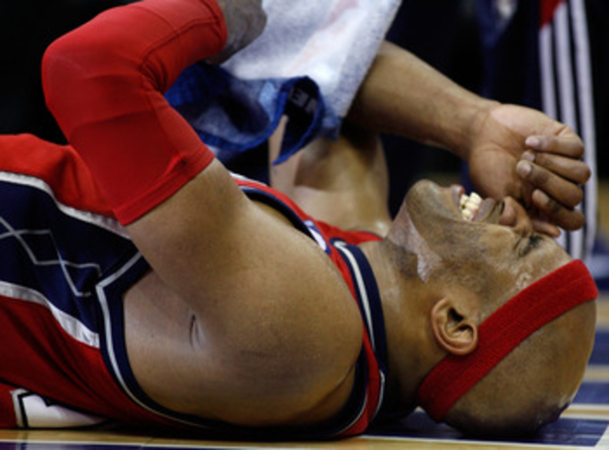 CLEVELAND - MAY 08:  Vince Carter #15 of the New Jersey Nets winces in pain after getting injured late in the fourth quarter against the Cleveland Cavaliers in Game Two of the Eastern Conference Semifinals during the 2007 NBA Playoffs at Quicken Loans Are