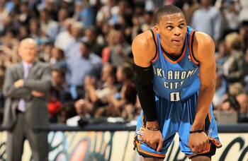 DENVER, CO - APRIL 25:  Russell Westbrook #0 of the Oklahoma City Thunder and head coach George Karl (L) of the Denver Nuggets look on in Game Four of the Western Conference Quarterfinals in the 2011 NBA Playoffs on April 24, 2011 at the Pepsi Center in D