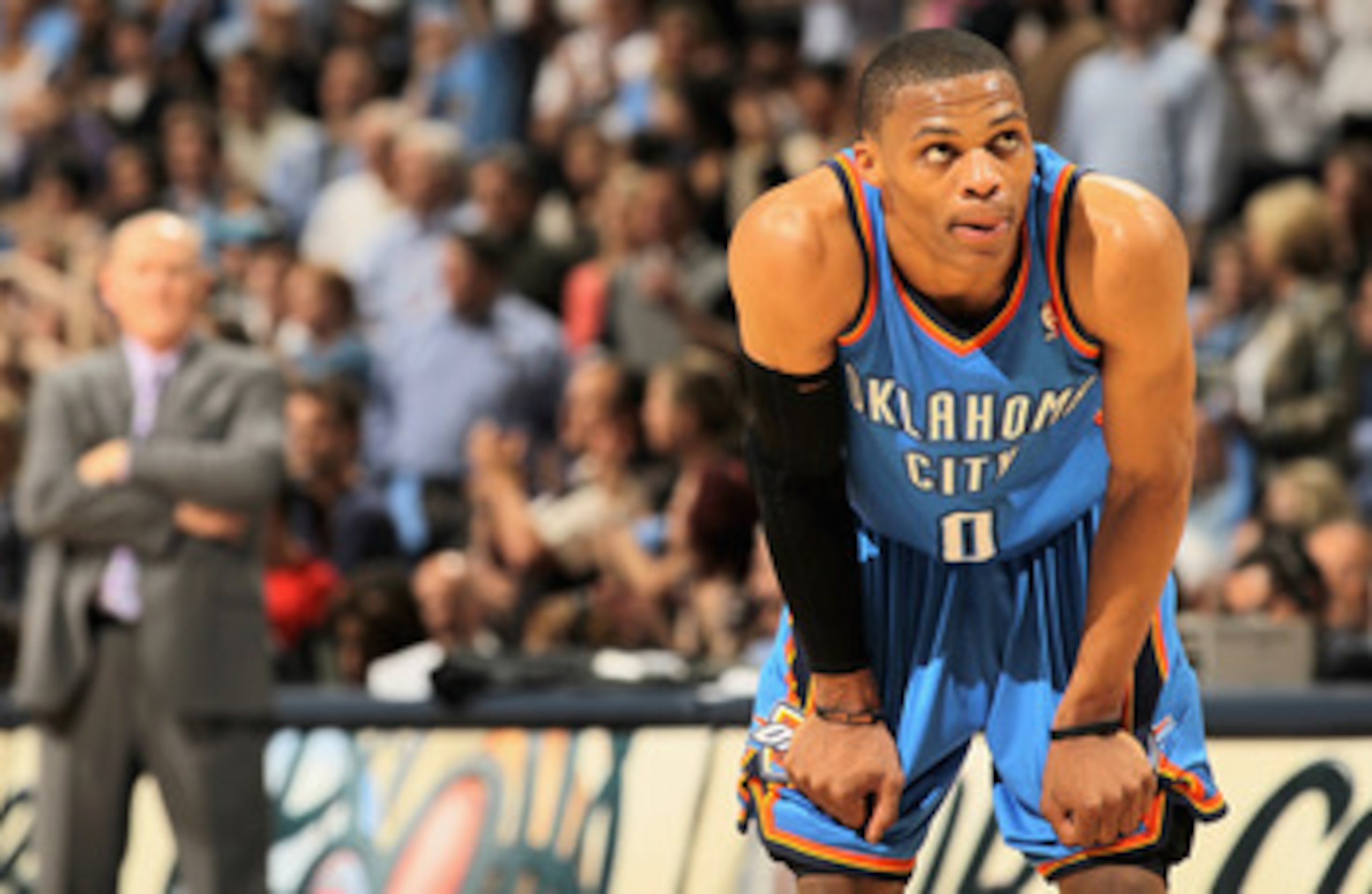 DENVER, CO - APRIL 25:  Russell Westbrook #0 of the Oklahoma City Thunder and head coach George Karl (L) of the Denver Nuggets look on in Game Four of the Western Conference Quarterfinals in the 2011 NBA Playoffs on April 24, 2011 at the Pepsi Center in D