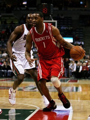 MILWAUKEE - FEBRUARY 09: Tracy McGrady #1 of the Houston Rockets drives past Luc Richard Mbah a Moute #12 of the Milwaukee Bucks on February 9, 2009 at the Bradley Center in Milwaukee, Wisconsin. The Bucks defeated the Rockets 124-112. NOTE TO USER: User 