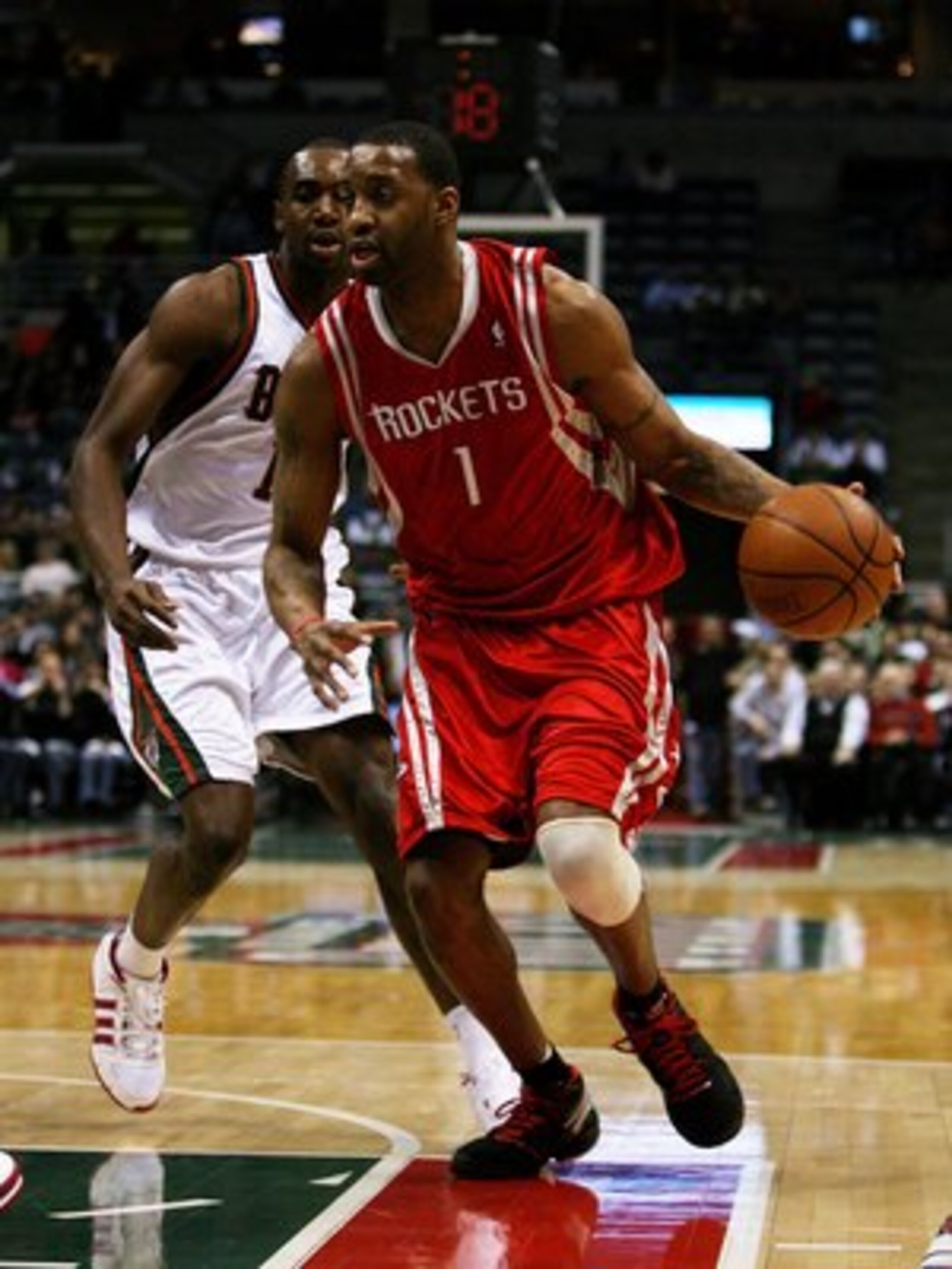 MILWAUKEE - FEBRUARY 09: Tracy McGrady #1 of the Houston Rockets drives past Luc Richard Mbah a Moute #12 of the Milwaukee Bucks on February 9, 2009 at the Bradley Center in Milwaukee, Wisconsin. The Bucks defeated the Rockets 124-112. NOTE TO USER: User 