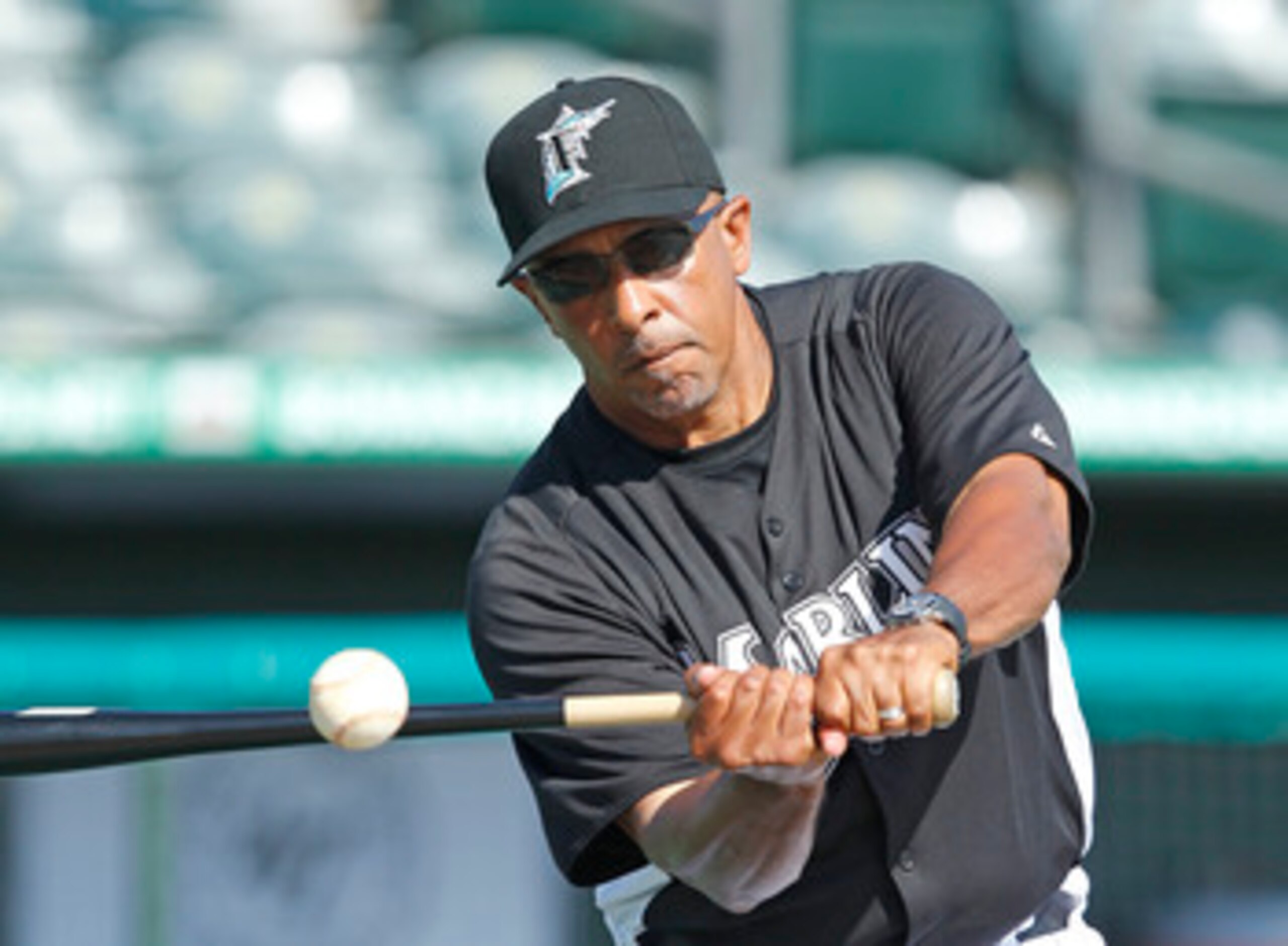 JUPITER, FL - MARCH 24: Manager Edwin Rodriguez #36 of the Florida Marlins hits the ball during fielding practice prior to the game against the Boston Red Sox at Roger Dean Stadium on March 24, 2011 in Jupiter, Florida. (Photo by Joel Auerbach/Getty Image