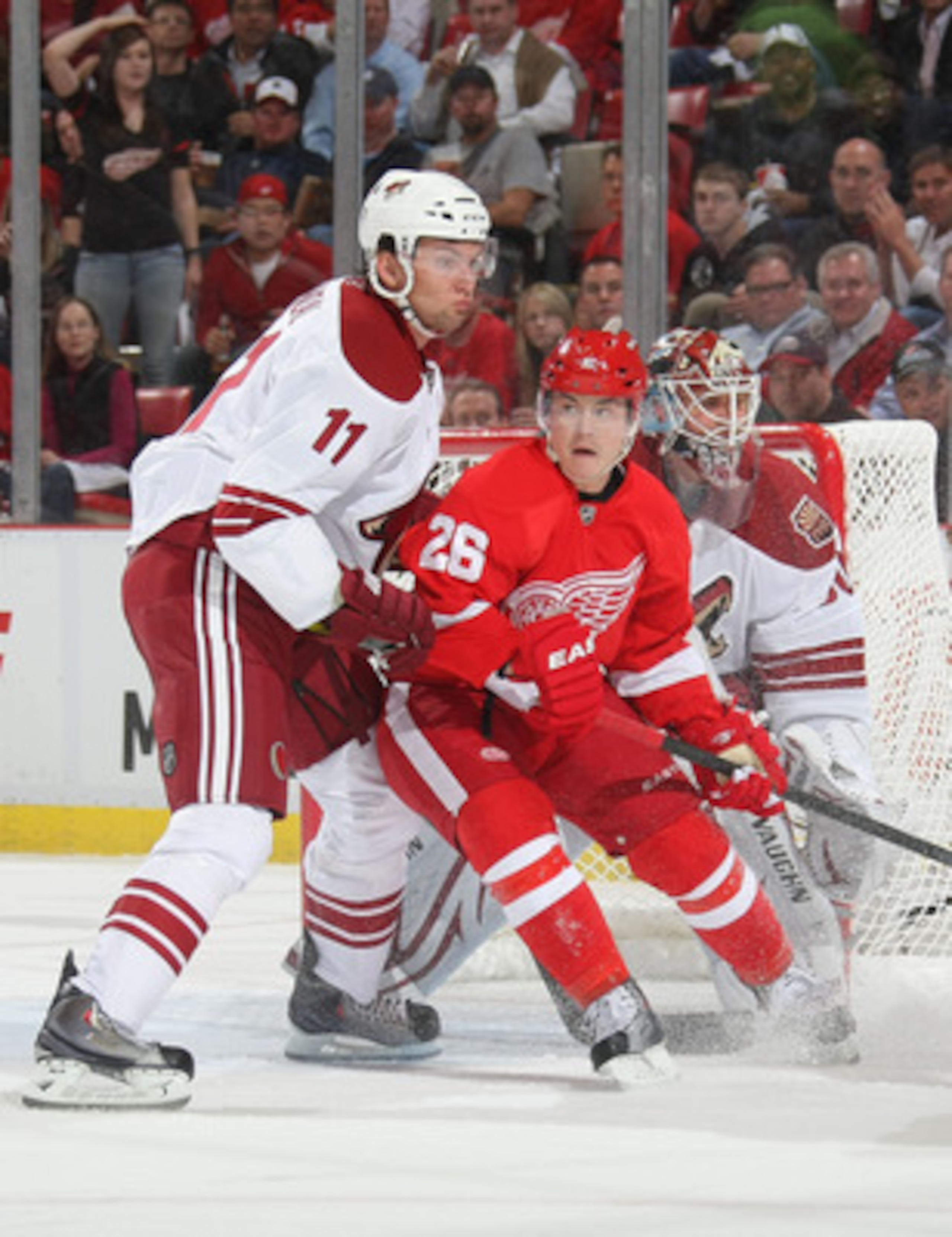 DETROIT, MI- APRIL 13:  Jiri Hudler #26 of the Detroit Red Wings battles for position with Martin Hanzal #11 of the Phoenix Coyotes in Game One of the Western Conference Quarterfinals during the 2011 NHL Stanley Cup Playoffs at Joe Louis Arena on April 13