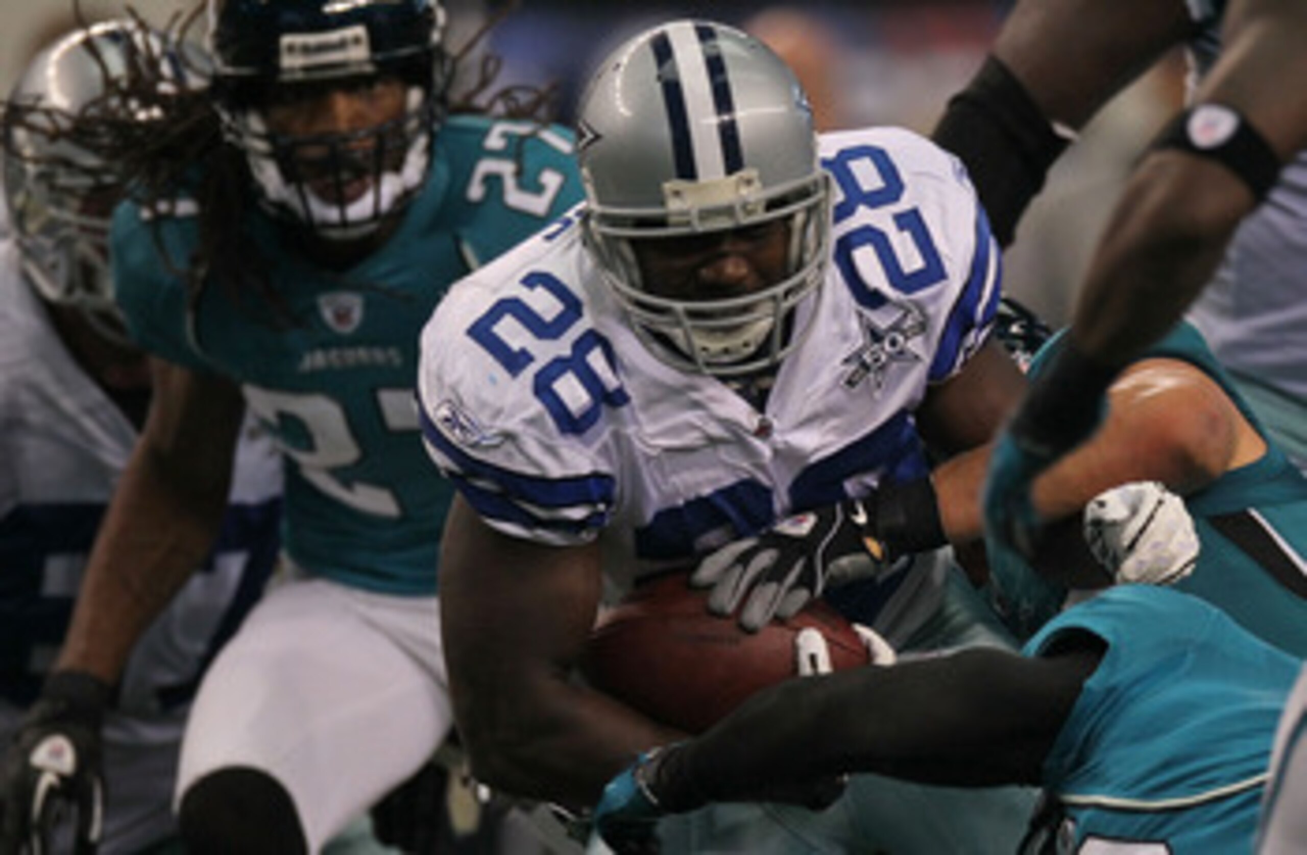 ARLINGTON, TX - OCTOBER 31:  Running back Felix Jones #28 of the Dallas Cowboys runs the ball against the Jacksonville Jaguars at Cowboys Stadium on October 31, 2010 in Arlington, Texas.  (Photo by Stephen Dunn/Getty Images)