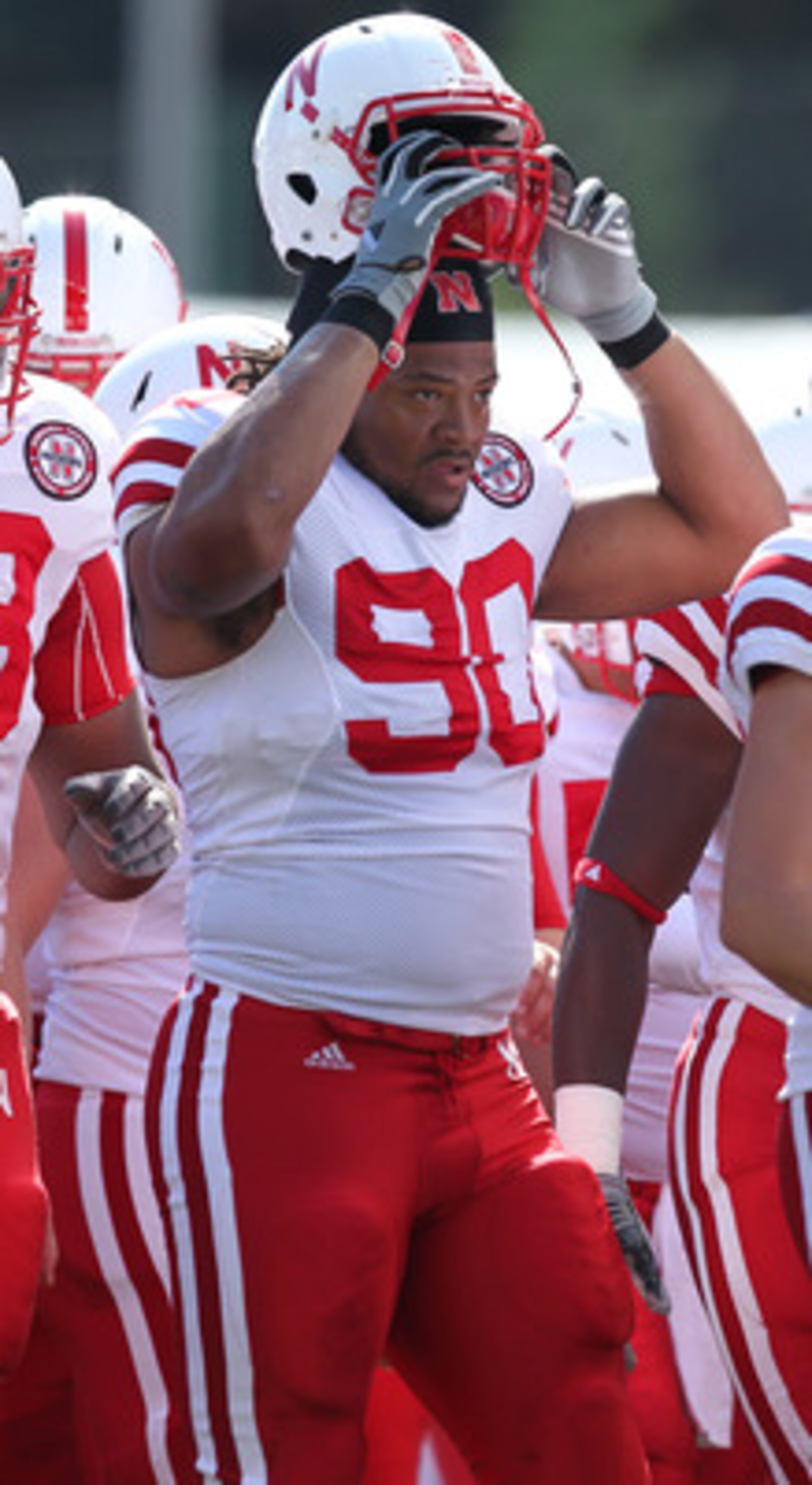 SEATTLE - SEPTEMBER 18: Defensive tackle Terrence Moore #90 of the Nebraska Cornhuskers looks on during warmups prior to the game against the Washington Huskies on September 18, 2010 at Husky Stadium in Seattle, Washington. (Photo by Otto Greule Jr/Getty