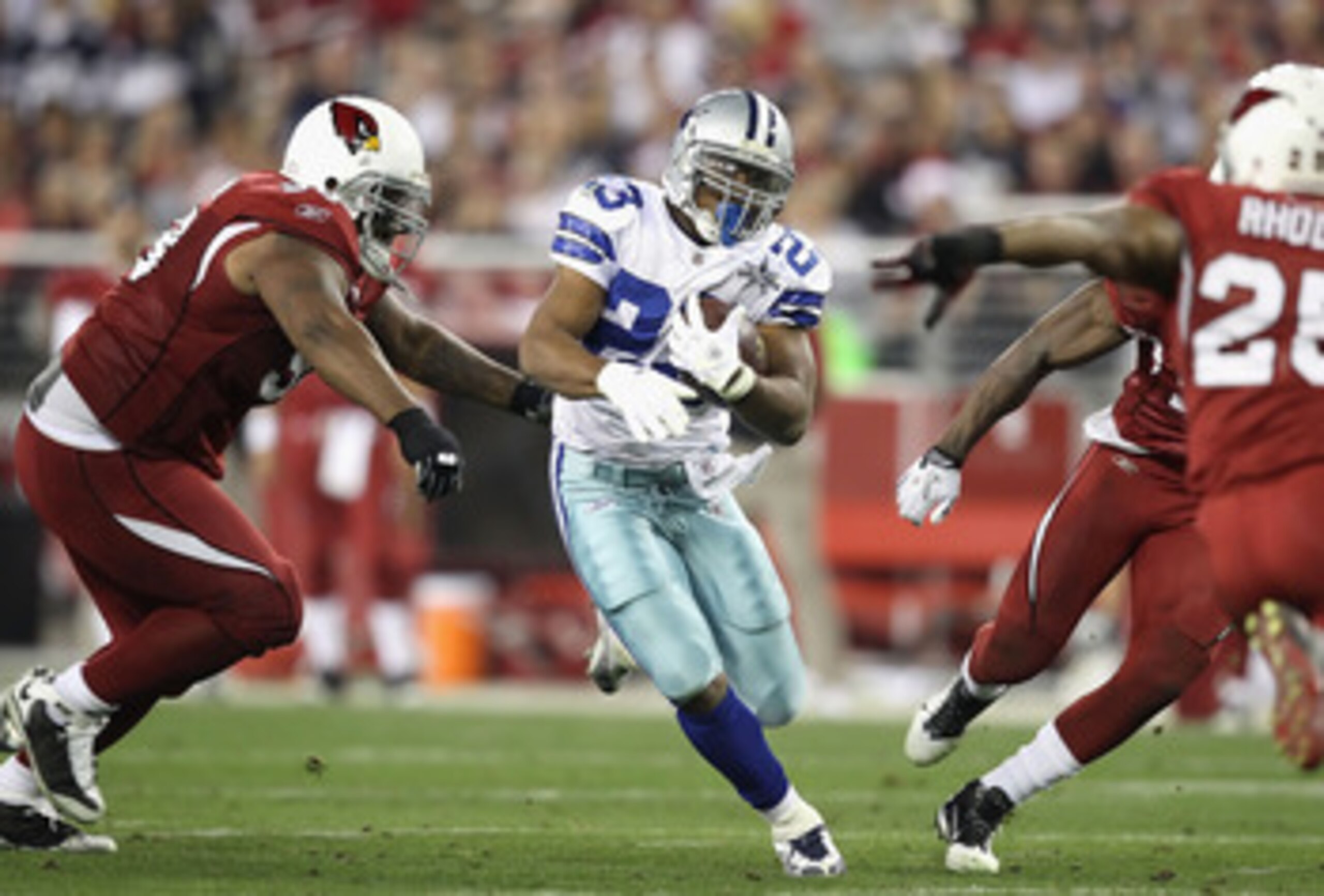 GLENDALE, AZ - DECEMBER 25:  Runningback Tashard Choice #23 of the Dallas Cowboys rushes the football during the NFL game against the Arizona Cardinals at the University of Phoenix Stadium on December 25, 2010 in Glendale, Arizona.  The Cardinals defeated