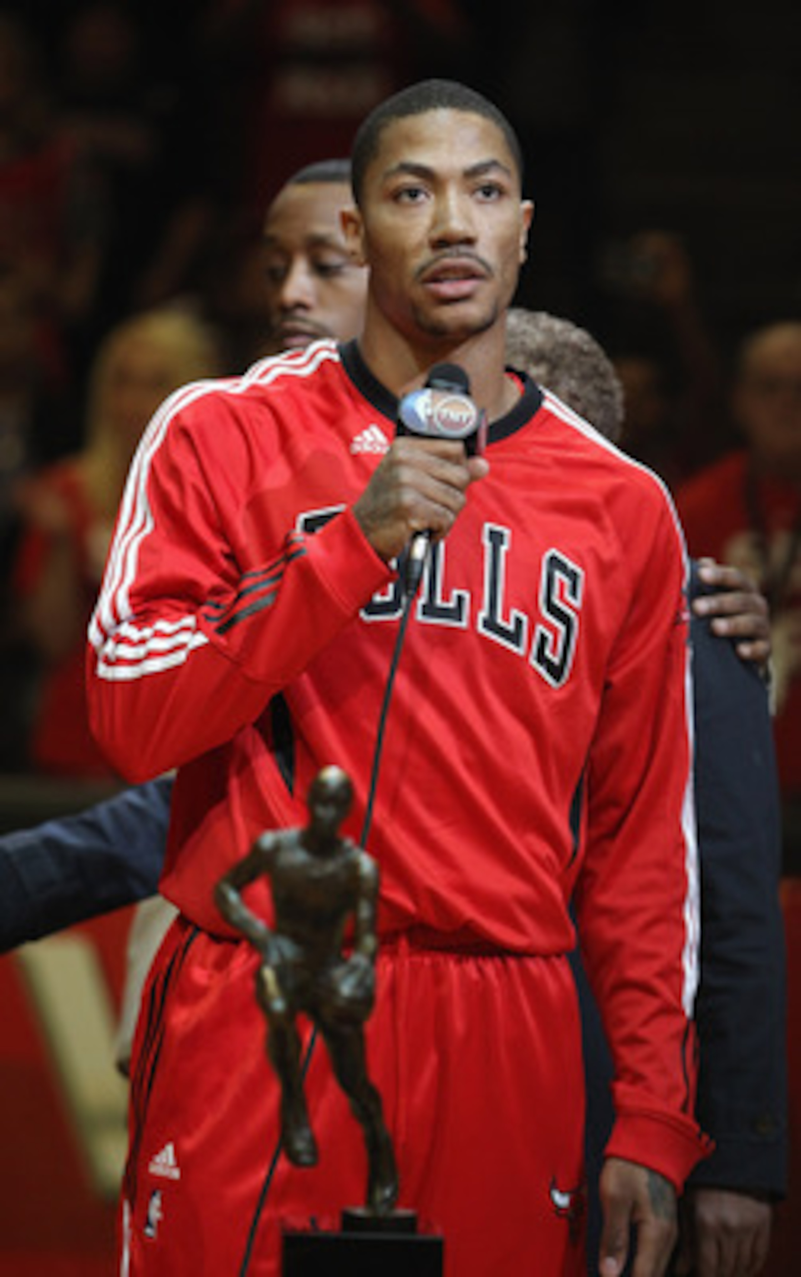 CHICAGO, IL - MAY 04: Derrick Rose #1 of the Chicago Bulls speaks to the crowd in front of the Maurice Podoloff Trophy awarded to the NBA Most Valuable Player before taking on the Atlanta Hawks in Game Two of the Eastern Conference Semifinals in the 2011