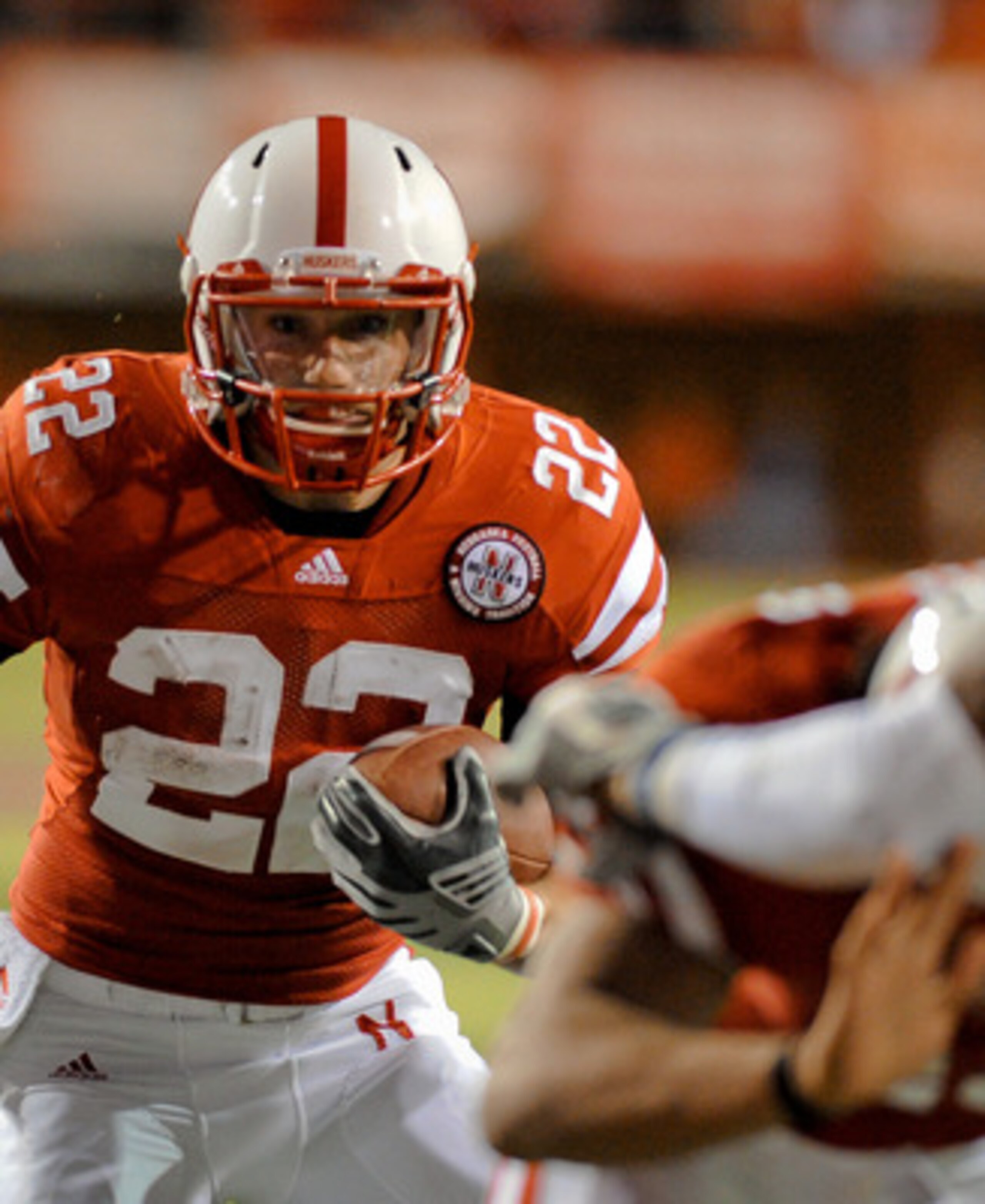 LINCOLN, NE - NOVEMBER 13: Rex Burkhead #22 of the Nebraska Cornhuskers scores a touchdown during first half action of their game at Memorial Stadium on November 13, 2010 in Lincoln, Nebraska. Nebraska  (Photo by Eric Francis/Getty Images)