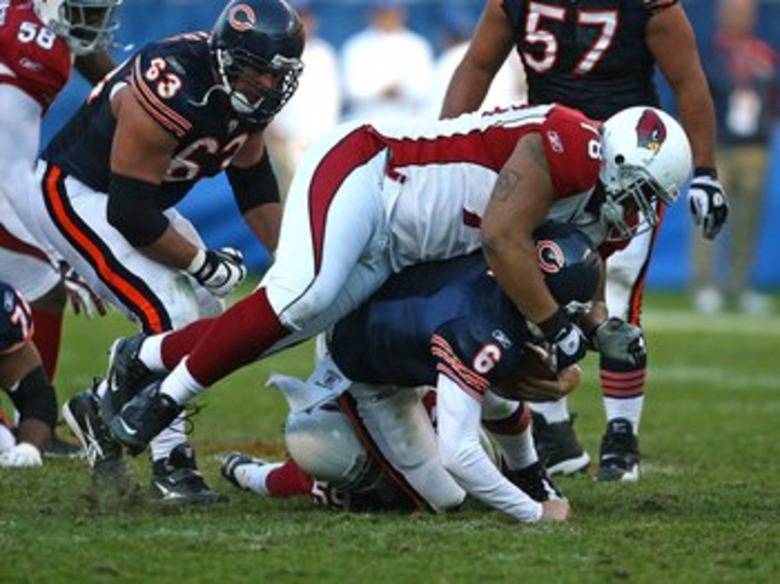 CHICAGO - NOVEMBER 08: Jay Cutler #6 of the Chicago Bears is sacked by Will Davis #59 and flattened by Alan Branch #78 of the Arizona Cardinals at Soldier Field on November 8, 2009 in Chicago, Illinois. The Cardinals defeated the Bears 41-21. (Photo by J CHICAGO - NOVEMBER 08: Jay Cutler #6 of the Chicago Bears is sacked by Will Davis #59 and flattened by Alan Branch #78 of the Arizona Cardinals at Soldier Field on November 8, 2009 in Chicago, Illinois. The Cardinals defeated the Bears 41-21. (Photo by J