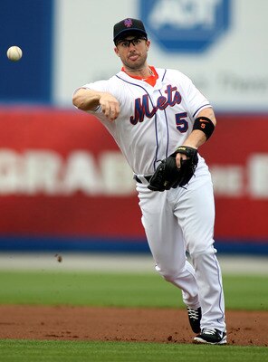 PORT ST. LUCIE, FL - FEBRUARY 26: Third baseman David Wright #5 throws against the Atlanta Braves at Digital Domain Park on February 26, 2011 in Port St. Lucie, Florida.  (Photo by Marc Serota/Getty Images)