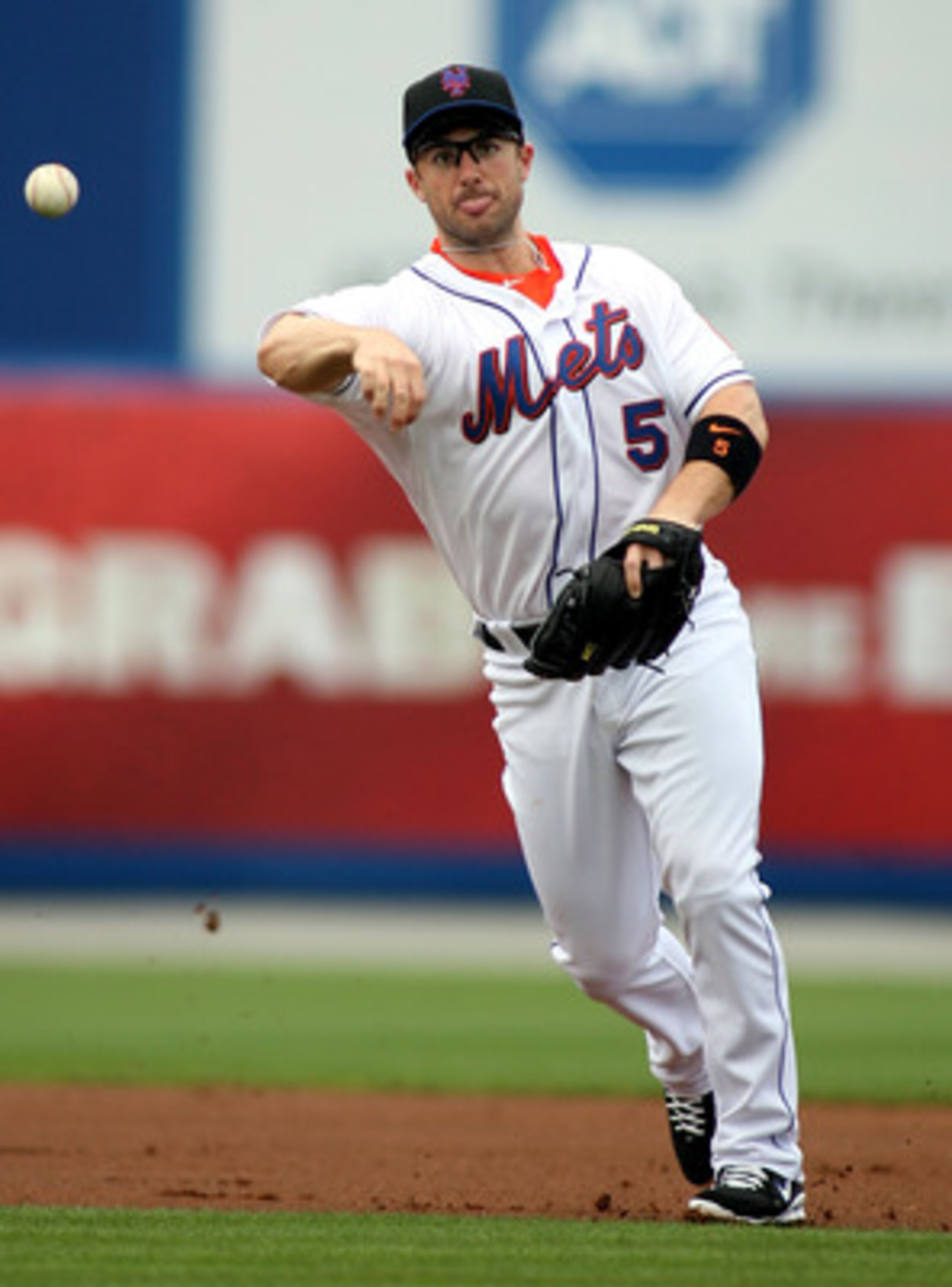 PORT ST. LUCIE, FL - FEBRUARY 26: Third baseman David Wright #5 throws against the Atlanta Braves at Digital Domain Park on February 26, 2011 in Port St. Lucie, Florida.  (Photo by Marc Serota/Getty Images)