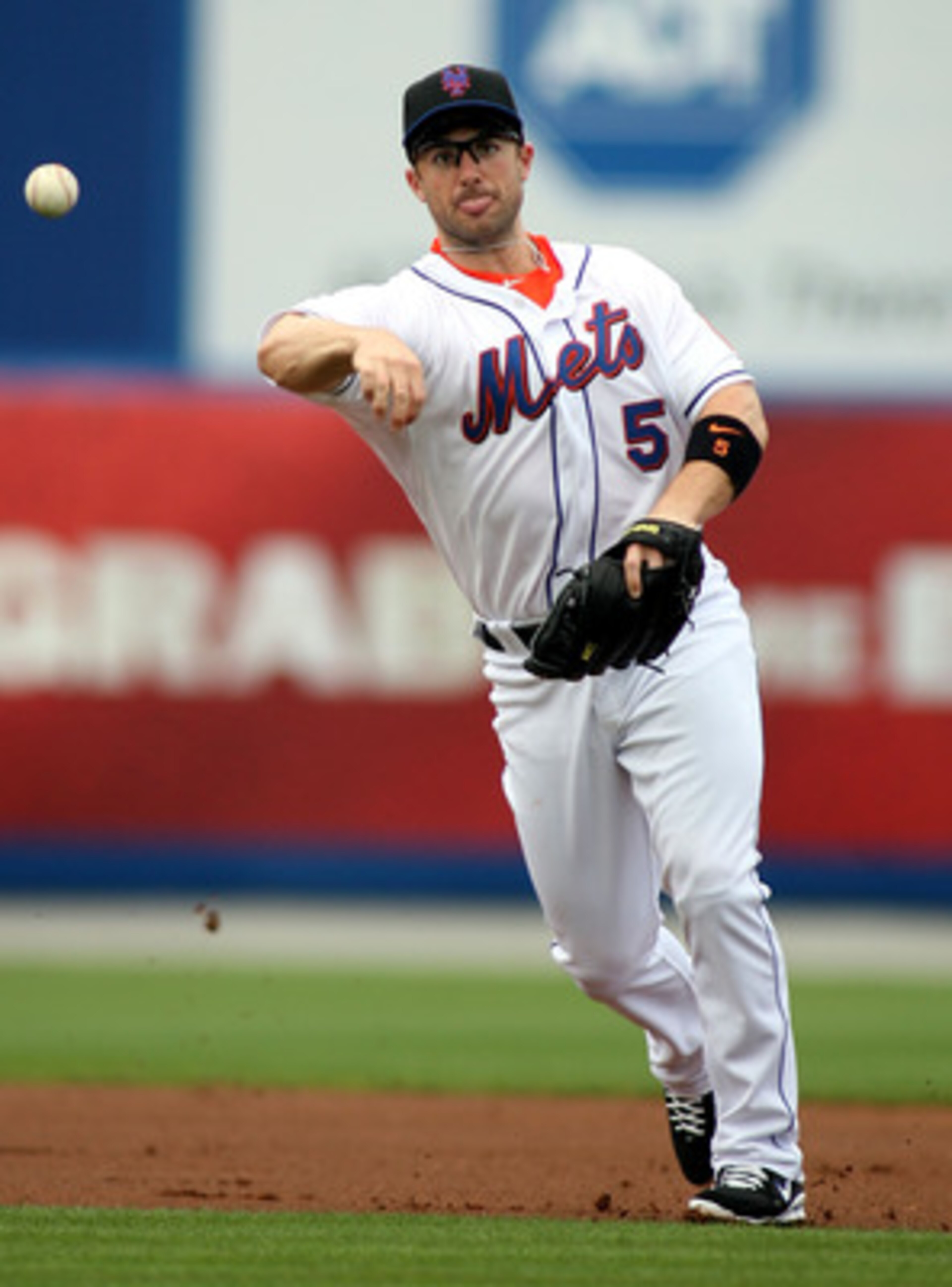 PORT ST. LUCIE, FL - FEBRUARY 26: Third baseman David Wright #5 throws against the Atlanta Braves at Digital Domain Park on February 26, 2011 in Port St. Lucie, Florida.  (Photo by Marc Serota/Getty Images)