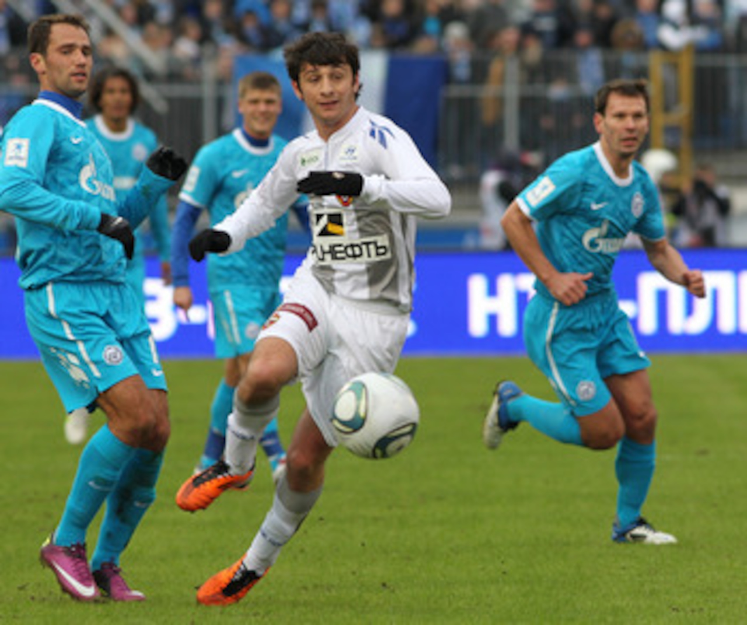 ST. PETERSBURG, RUSSIA - APRIL 10:  Roman Shirokov of FC Zenit St. Petersburg battles for the ball with Alan Dzagoev of PFC CSKA Moscow during the Russian Football League Championship match between FC Zenit St Petersburg and PFC CSKA Moscow at the Petrovs