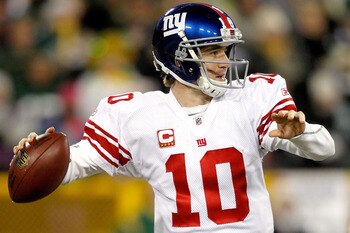 GREEN BAY, WI - DECEMBER 26:  Eli Manning #10 of the New York Giants throws against the Green Bay Packers at Lambeau Field on December 26, 2010 in Green Bay, Wisconsin.  (Photo by Matthew Stockman/Getty Images)