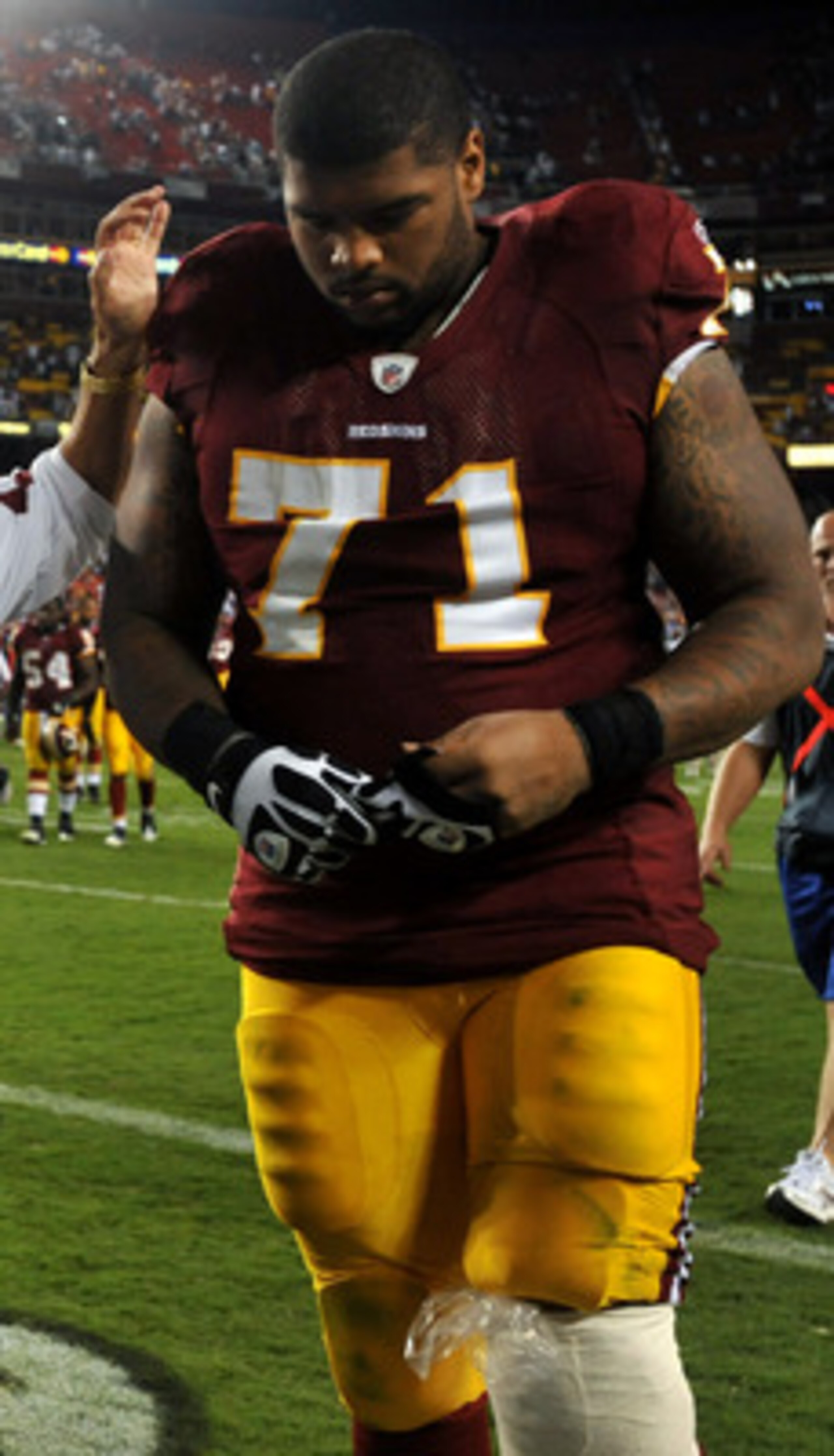 LANDOVER - SEPTEMBER 19:  Trent Williams #71 of the Washington Redskins is consoled by head coach Mike Shanahan during the game against the Houston Texans at FedExField on September 19, 2010 in Landover, Maryland. The Texans defeated the Redskins in overt