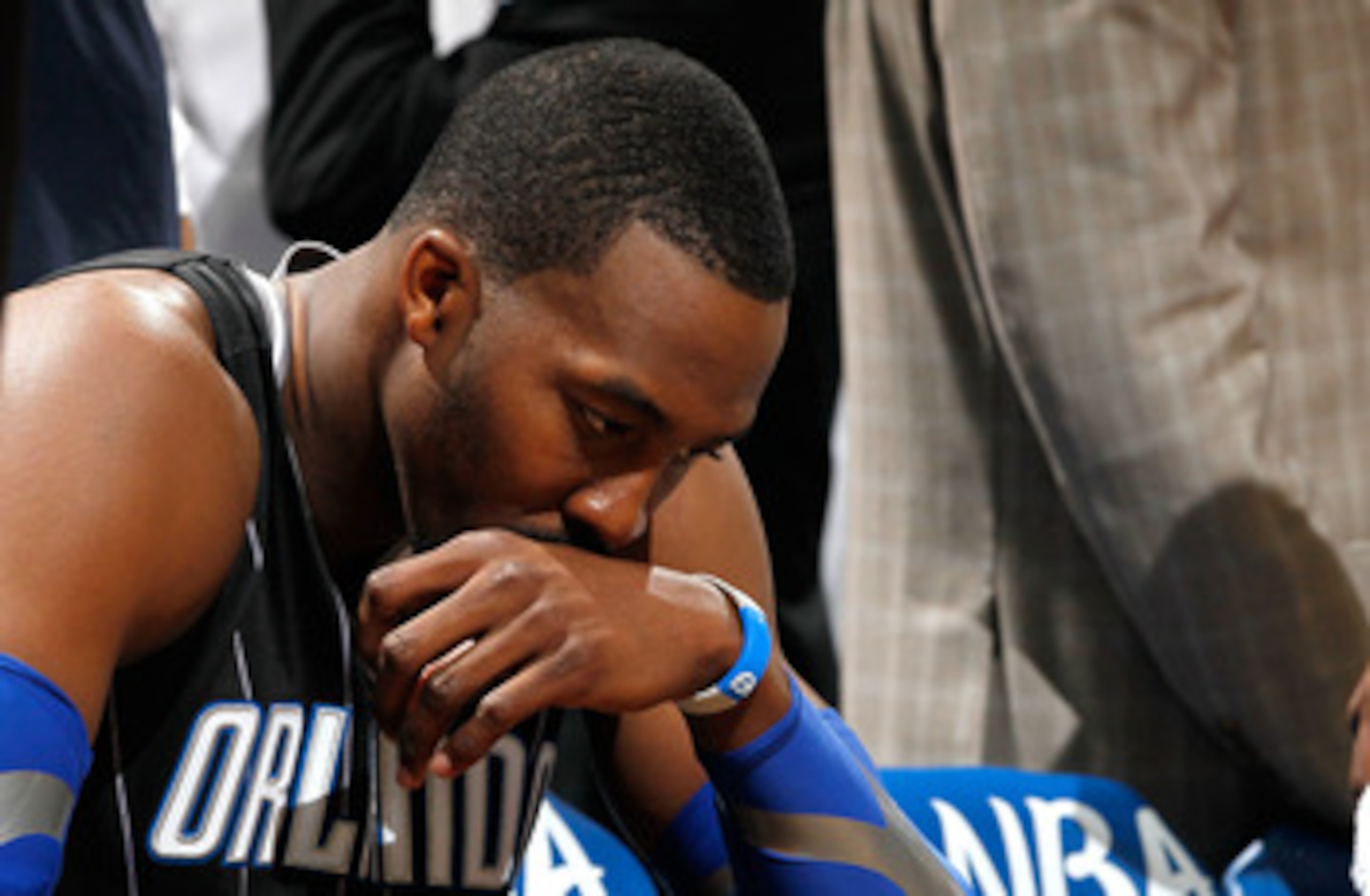 ATLANTA, GA - APRIL 28:  Dwight Howard #12 of the Orlando Magic sits on the bench during a timeout before the final seconds against the Atlanta Hawks during Game Six of the Eastern Conference Quarterfinals in the 2011 NBA Playoffs at Philips Arena on Apri