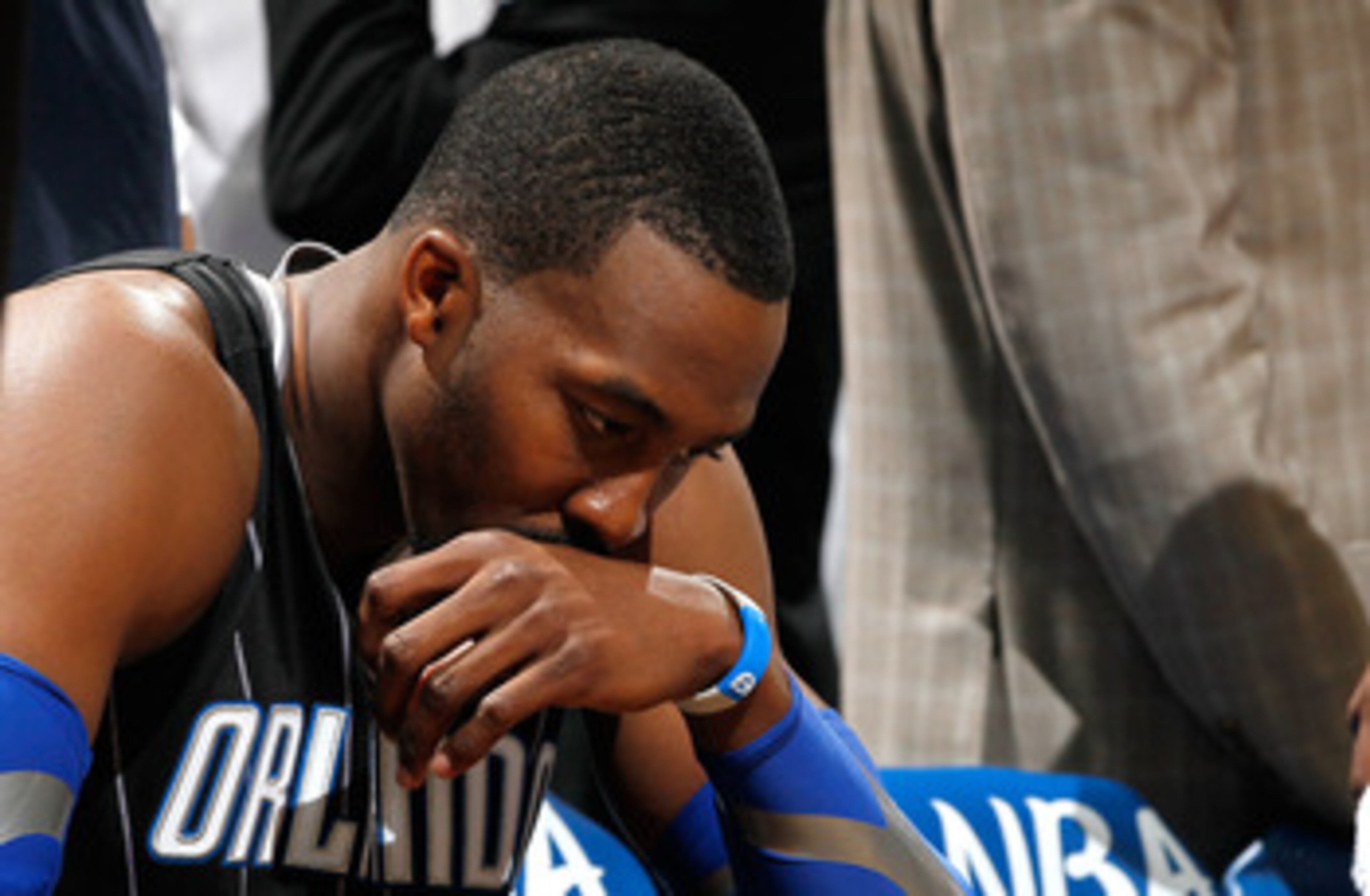 ATLANTA, GA - APRIL 28: Dwight Howard #12 of the Orlando Magic sits on the bench during a timeout before the final seconds against the Atlanta Hawks during Game Six of the Eastern Conference Quarterfinals in the 2011 NBA Playoffs at Philips Arena on Apri ATLANTA, GA - APRIL 28: Dwight Howard #12 of the Orlando Magic sits on the bench during a timeout before the final seconds against the Atlanta Hawks during Game Six of the Eastern Conference Quarterfinals in the 2011 NBA Playoffs at Philips Arena on Apri