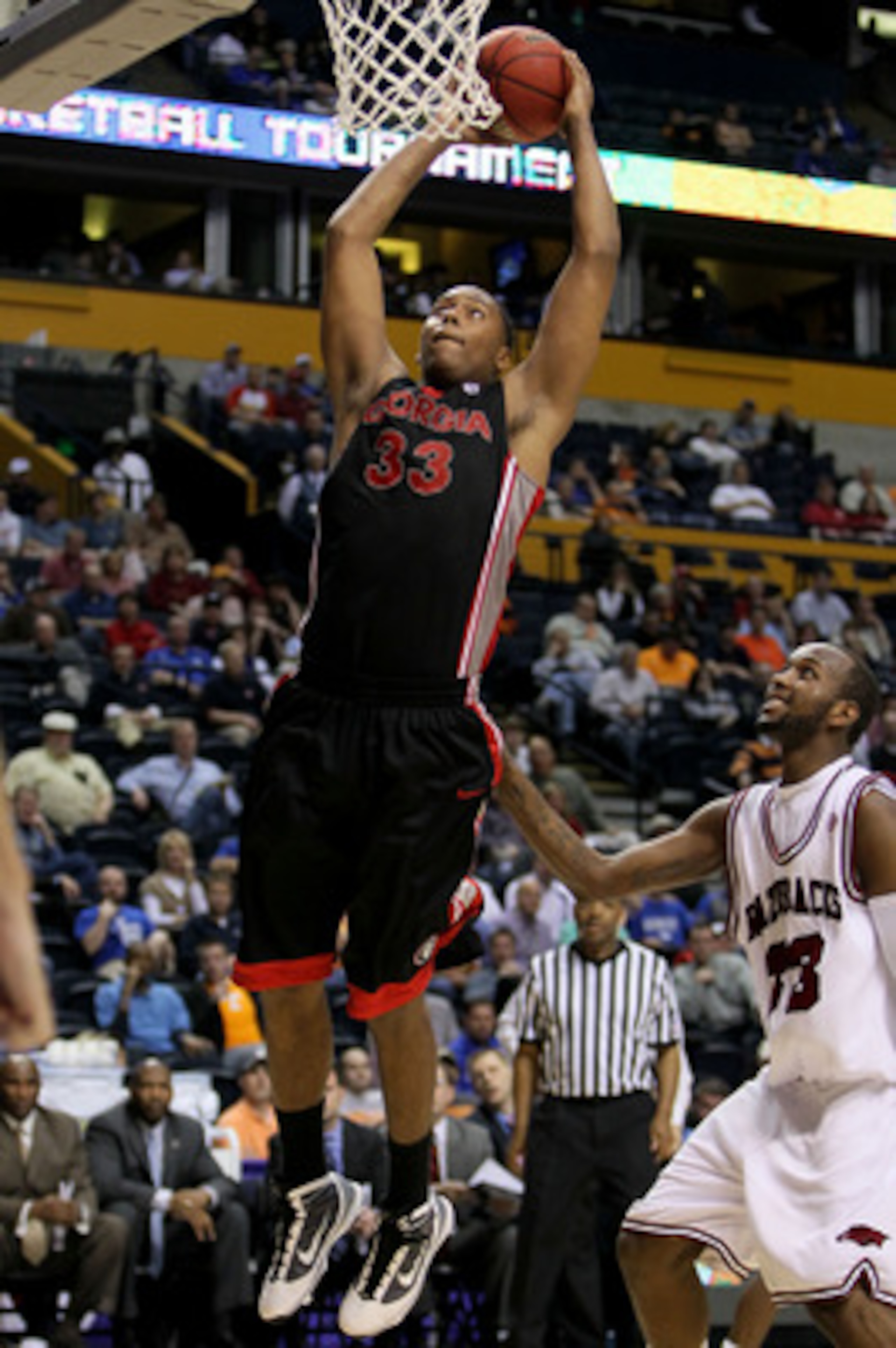 NASHVILLE, TN - MARCH 11:  Trey Thompkins #33 of the Georgia Bulldogs goes up for a dunk attempt against the Arkanasas Razorbacks during the first round of the SEC Men's Basketball Tournament at the Bridgestone Arena on March 11, 2010 in Nashville, Tennes
