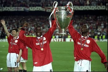 26 May 1999:  Dwight Yorke (left) and Andy Cole Of Manchester United  hold the European Cup after beating Bayern Munich in the European Champions League Final in the Nou Camp Stadium, Barcelona, Spain. Manchester United won 2 - 1 with both United goals sc