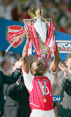 HIGHBURY, LONDON - MAY 15:  Captain Patrick Vieira of Arsenal lifts the Premiership trophy during the FA Barclaycard Premiership match between Arsenal and Leicester City at Highbury on May 15, 2004 in London. (Photo by Clive Mason/Getty Images)