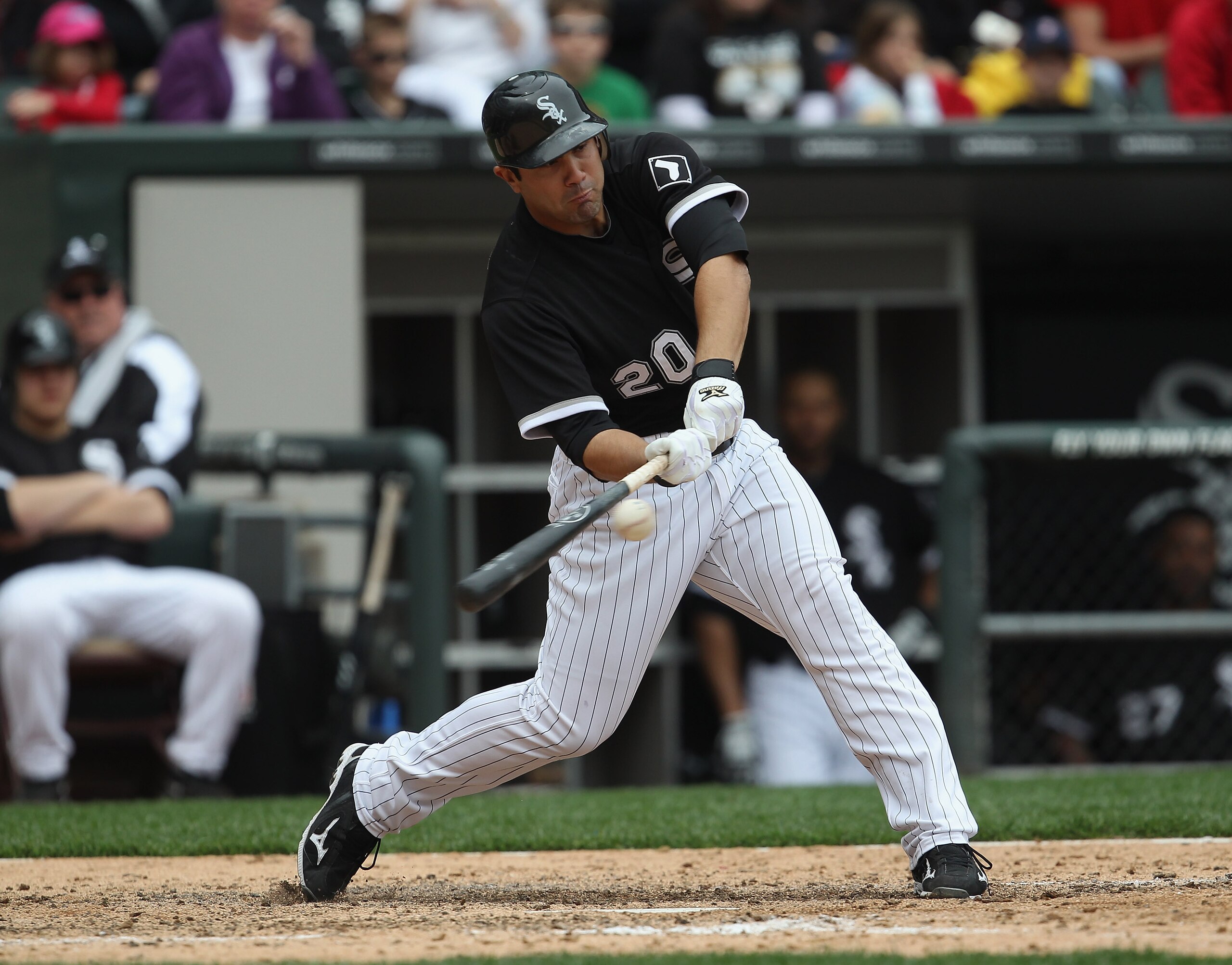 CHICAGO, IL - MAY 01: Carlos Quentin #20 of the Chicago White Sox hits the ball against the Baltimore Orioles at U.S. Cellular Field on May 1, 2011 in Chicago, Illinois. The Orioles defeated the White Sox 6-4. (Photo by Jonathan Daniel/Getty Images)