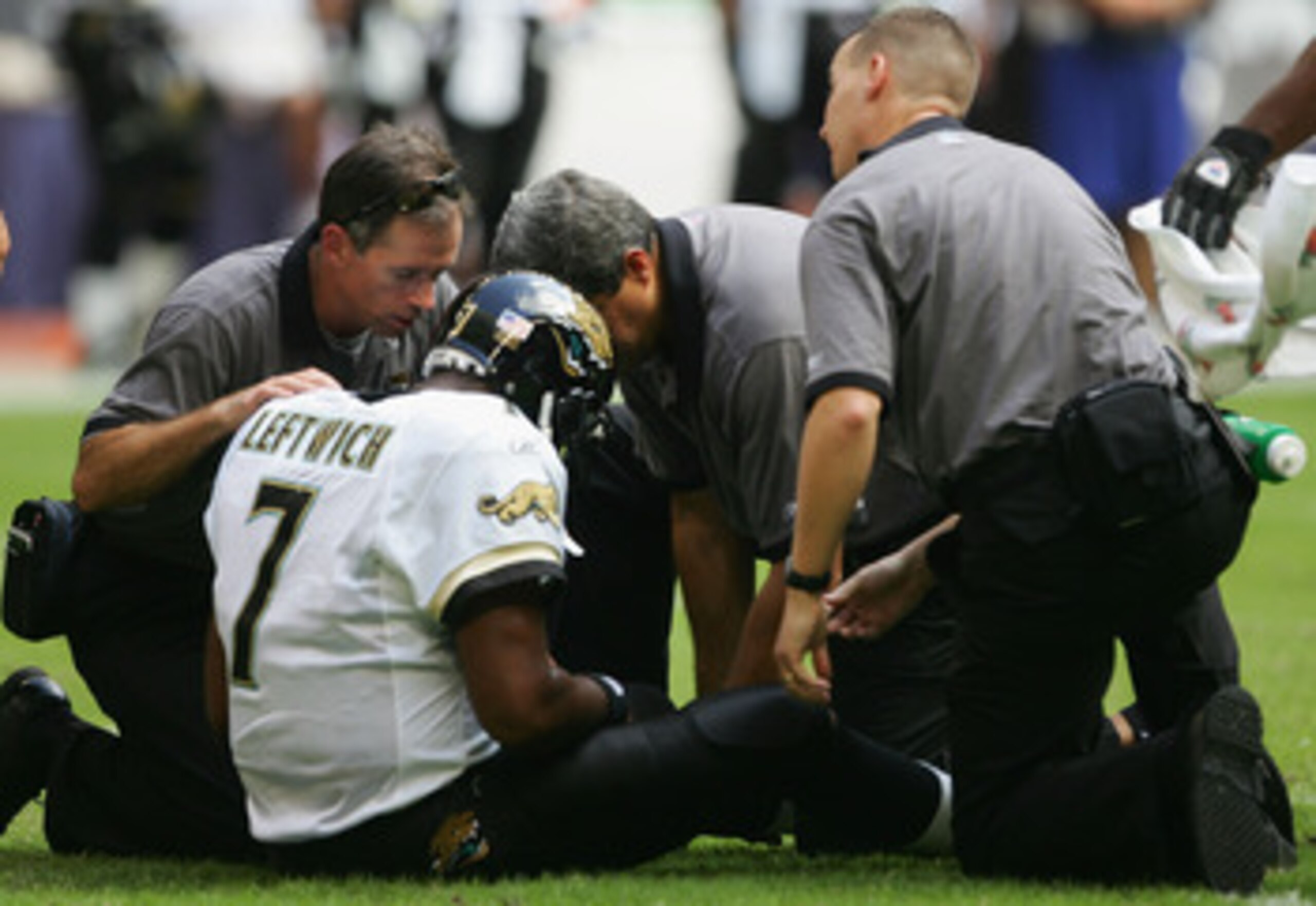 HOUSTON, TX - OCTOBER 31:  Byron Leftwich #7 of the Jacksonville Jaguars gets attended to after getting injured in the first hafl of the game against the Houston Texans won by the Texans 20-6 on October 31, 2004 at the Reliant Stadium in Houston, Texas.
