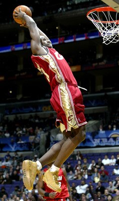 LOS ANGELES - FEBRUARY 13:  LeBron James #23 from the Cleveland Cavaliers of the Rookie Team goes up for a dunk during the Got Milk? Rookie Challenge, part of the 53rd NBA All-Star weekend at the Staples Center on February 13, 2004 in Los Angeles, Califor