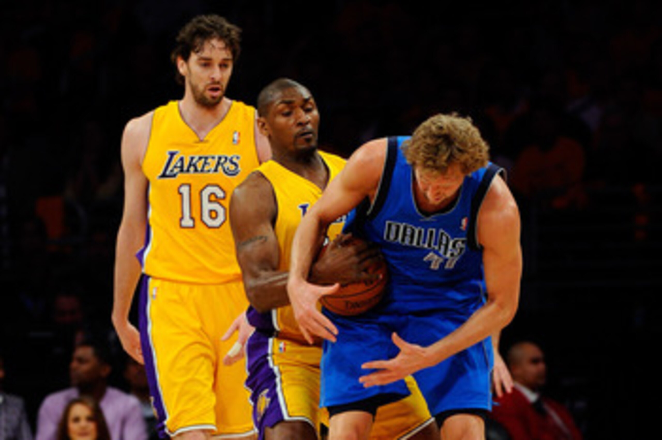 LOS ANGELES, CA - MAY 02:  Dirk Nowitzki #41 of the Dallas Mavericks holds onto the ball as Ron Artest #15 of the Los Angeles Lakers attempts to steal it in the first quarter of Game One of the Western Conference Semifinals in the 2011 NBA Playoffs at Sta