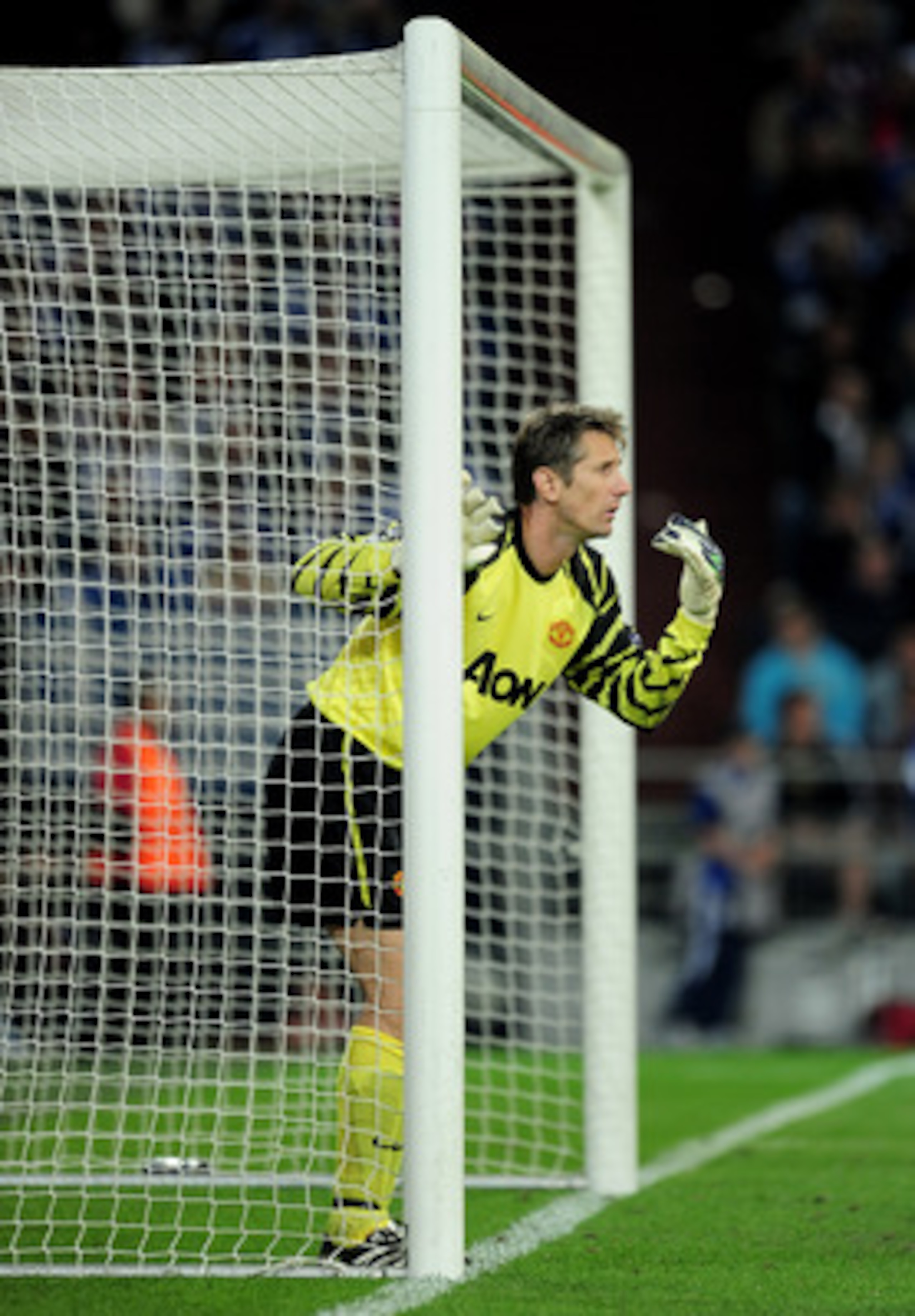 GELSENKIRCHEN, GERMANY - APRIL 26:   Edwin van der Sar of Manchester United gestures during the UEFA Champions League Semi Final first leg match between FC Schalke 04 and Manchester United at Veltins Arena on April 26, 2011 in Gelsenkirchen, Germany.  (Ph