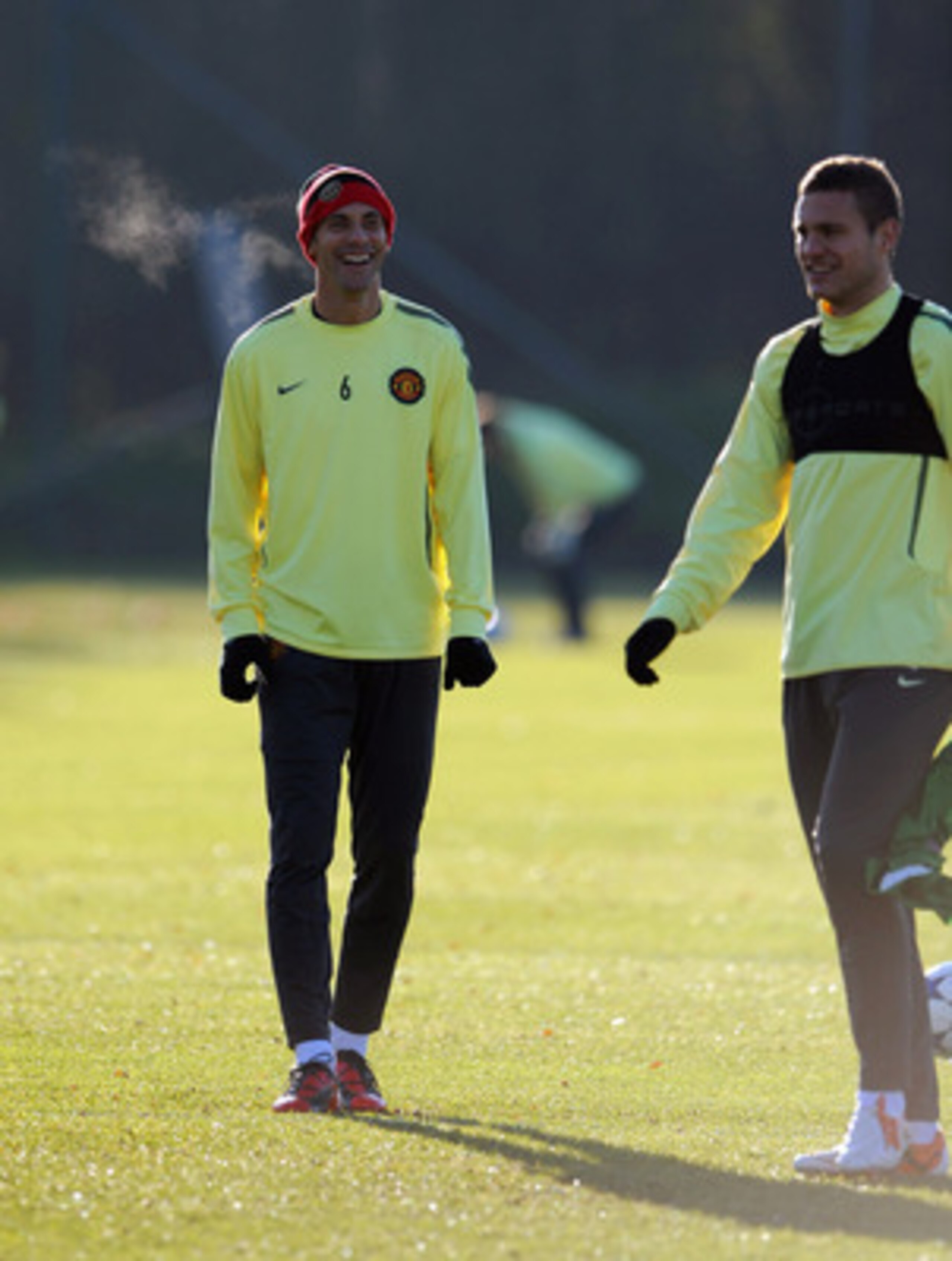 MANCHESTER - NOVEMBER 23:  Rio Ferdinand (L) and Nemanja Vidic of Manchester United during a training session ahead of their UEFA Champions League Group C match against Rangers FC at Carrington Training Ground on November 23, 2010 in Manchester, England. 