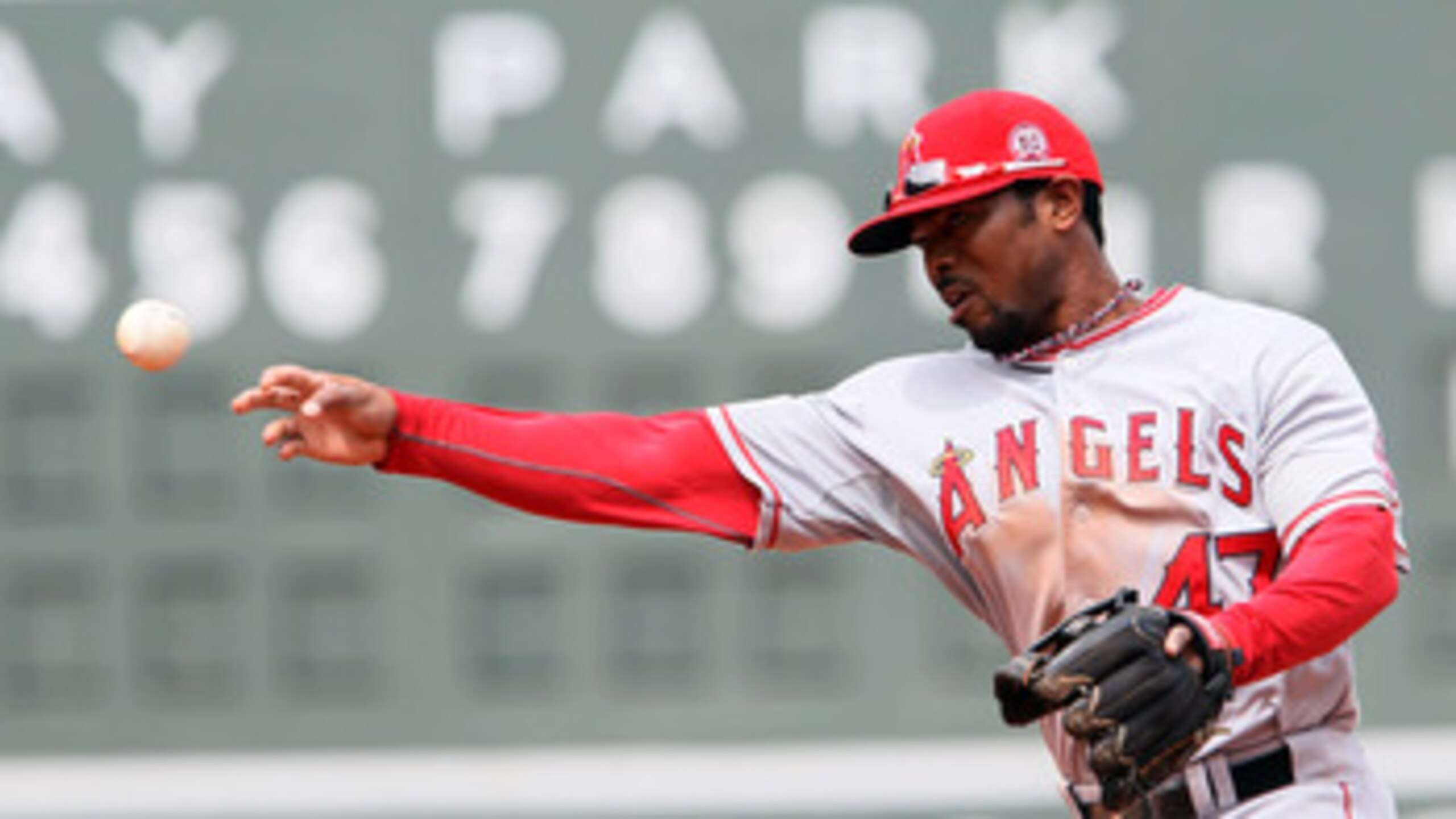 BOSTON, MA - MAY 05:  Howard Kendrick #47 of the Los Angeles Angels sends the ball to first for the out in the against the Boston Red Sox on May 5, 2011 at Fenway Park in Boston, Massachusetts.  (Photo by Elsa/Getty Images)
