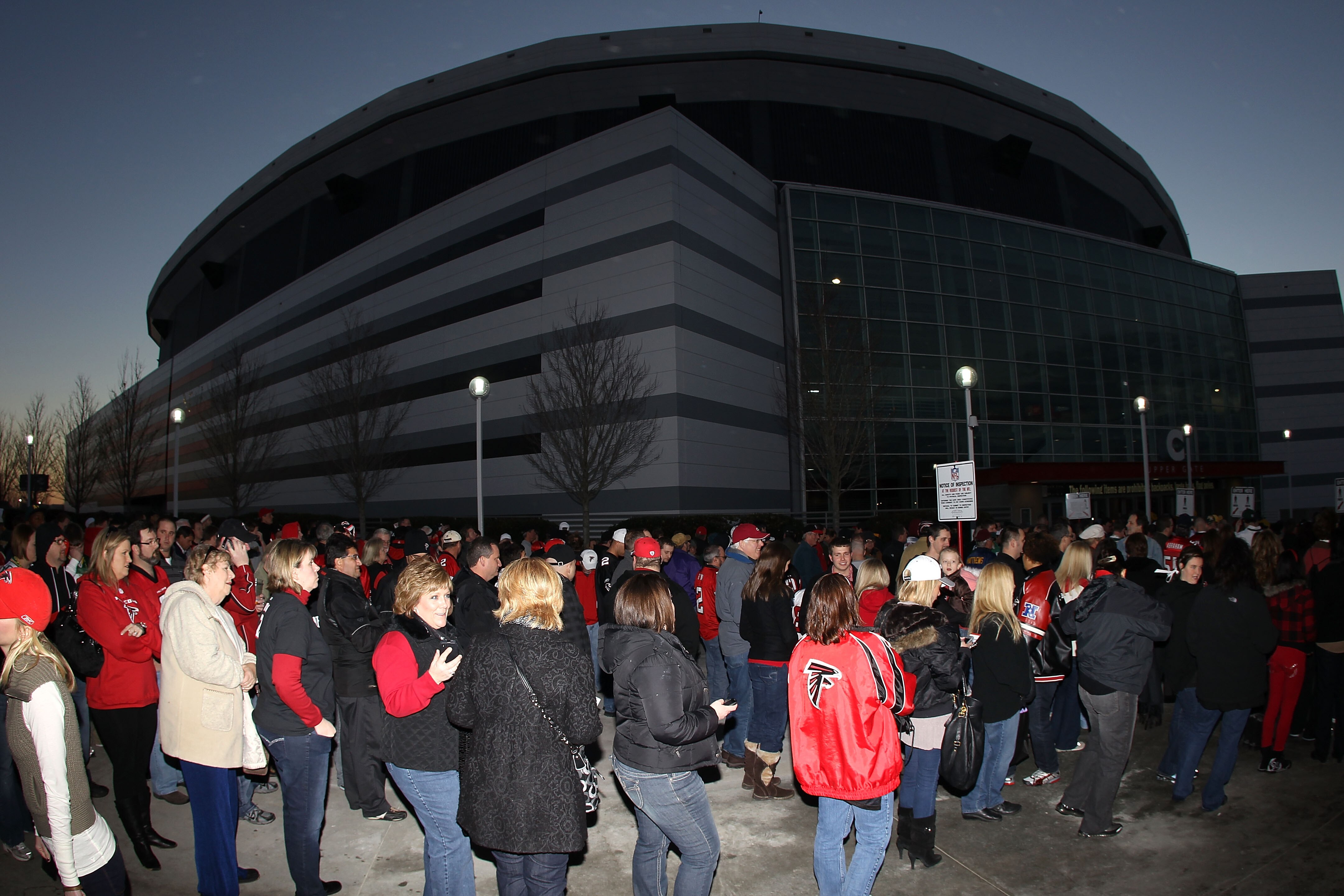 ATLANTA, GA - JANUARY 15:  Fans wiat outside to enter the stadium to watch the Atlanta Falcons play against the Green Bay Packers during their 2011 NFC divisional playoff game at Georgia Dome on January 15, 2011 in Atlanta, Georgia.  (Photo by Streeter Le