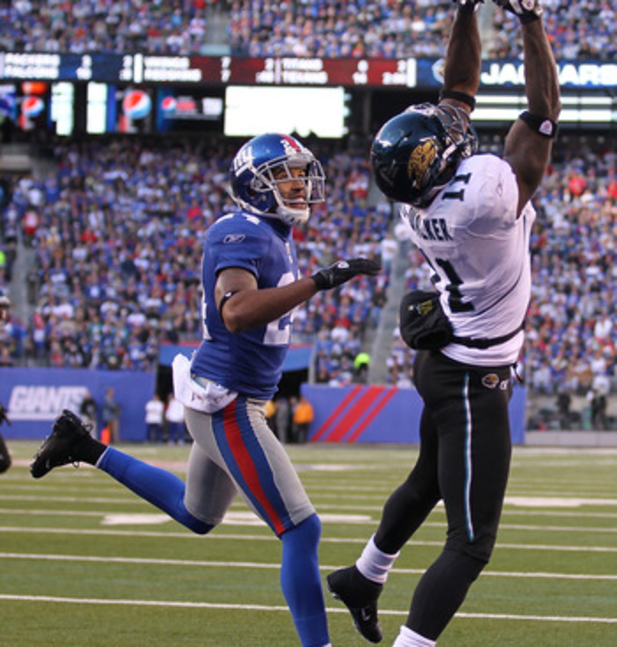 EAST RUTHERFORD, NJ - NOVEMBER 28: Mike Sims Walker #11 of the Jacksonville Jaguars misses the ball as Terrell Thomas #24 of the New York Giants defends during their game on November 28, 2010 at The New Meadowlands Stadium in East Rutherford, New Jersey. EAST RUTHERFORD, NJ - NOVEMBER 28: Mike Sims Walker #11 of the Jacksonville Jaguars misses the ball as Terrell Thomas #24 of the New York Giants defends during their game on November 28, 2010 at The New Meadowlands Stadium in East Rutherford, New Jersey.