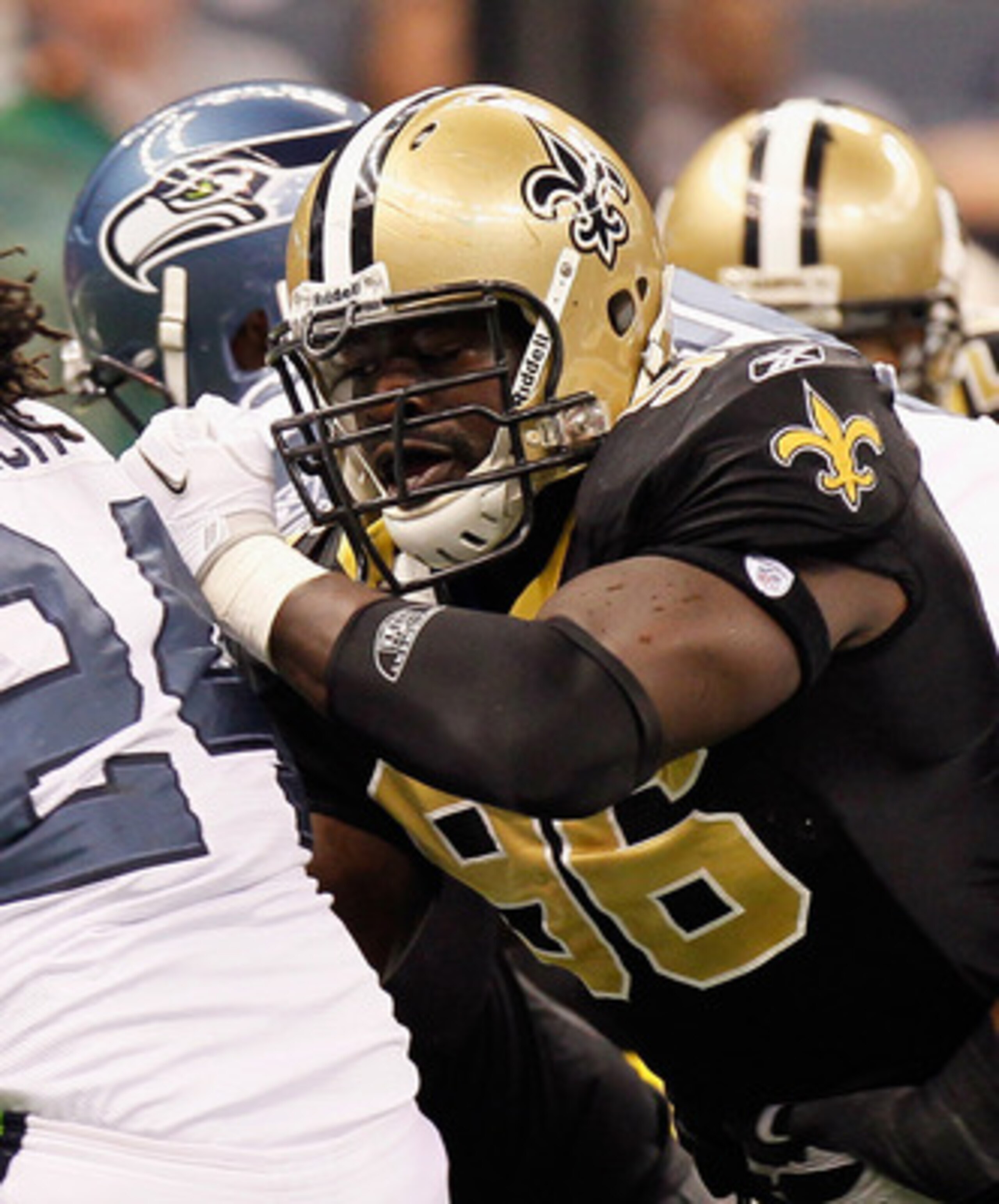 NEW ORLEANS - NOVEMBER 21:  Marshawn Lynch #24 of the Seattle Seahawks against Alex Brown #96 of the New Orleans Saints at Louisiana Superdome on November 21, 2010 in New Orleans, Louisiana.  (Photo by Kevin C. Cox/Getty Images)