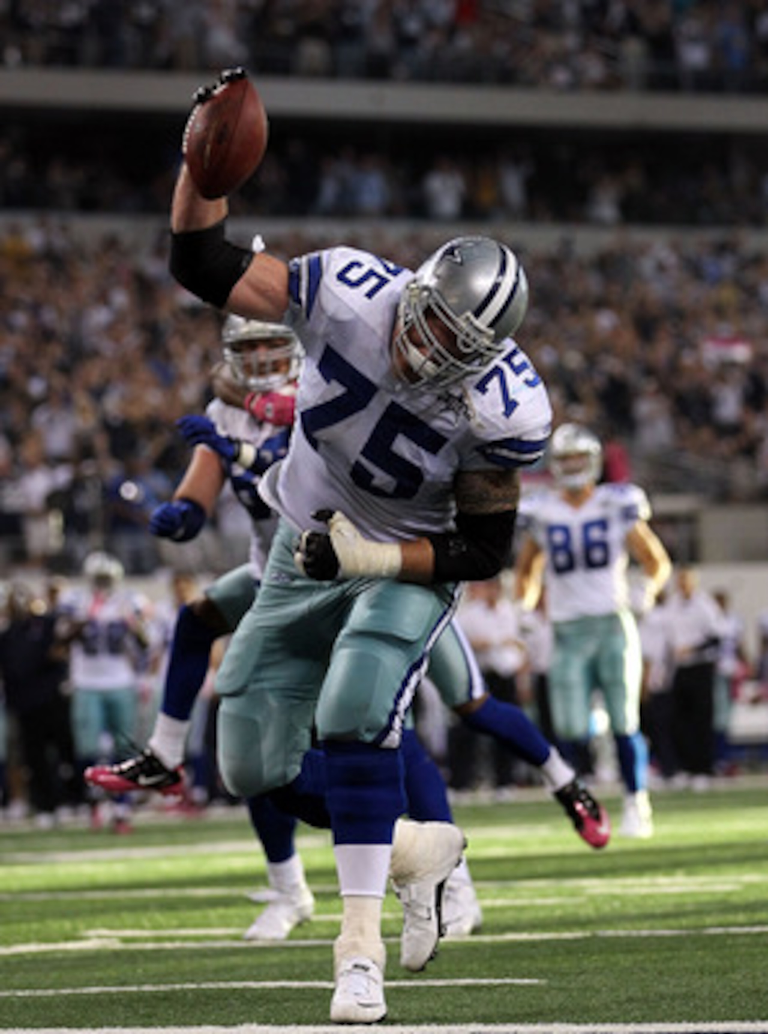 ARLINGTON, TX - OCTOBER 10:  Marc Colombo #75 of the Dallas Cowboys spikes the ball after a touchdown by Jason Witten against the Tennessee Titans at Cowboys Stadium on October 10, 2010 in Arlington, Texas.  (Photo by Ronald Martinez/Getty Images)