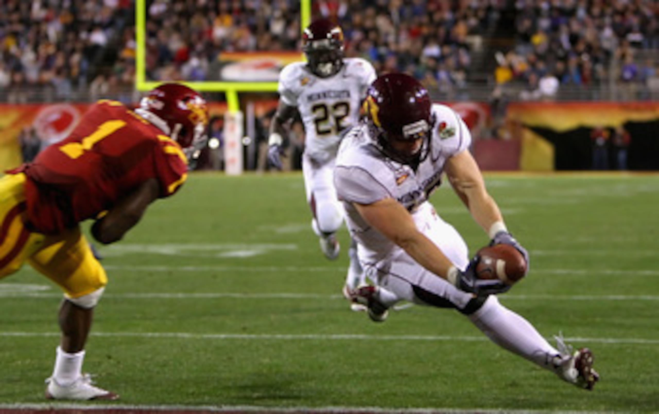 TEMPE, AZ - DECEMBER 31: Tight end Nick Tow-Arnett #48 of the Minnesota Golden Gophers dives into the endzone to score on a 23 yard reception past David Sims #1 of the Iowa State Cyclones during the Insight Bowl at Arizona Stadium on December 31, 2009 in TEMPE, AZ - DECEMBER 31: Tight end Nick Tow-Arnett #48 of the Minnesota Golden Gophers dives into the endzone to score on a 23 yard reception past David Sims #1 of the Iowa State Cyclones during the Insight Bowl at Arizona Stadium on December 31, 2009 in