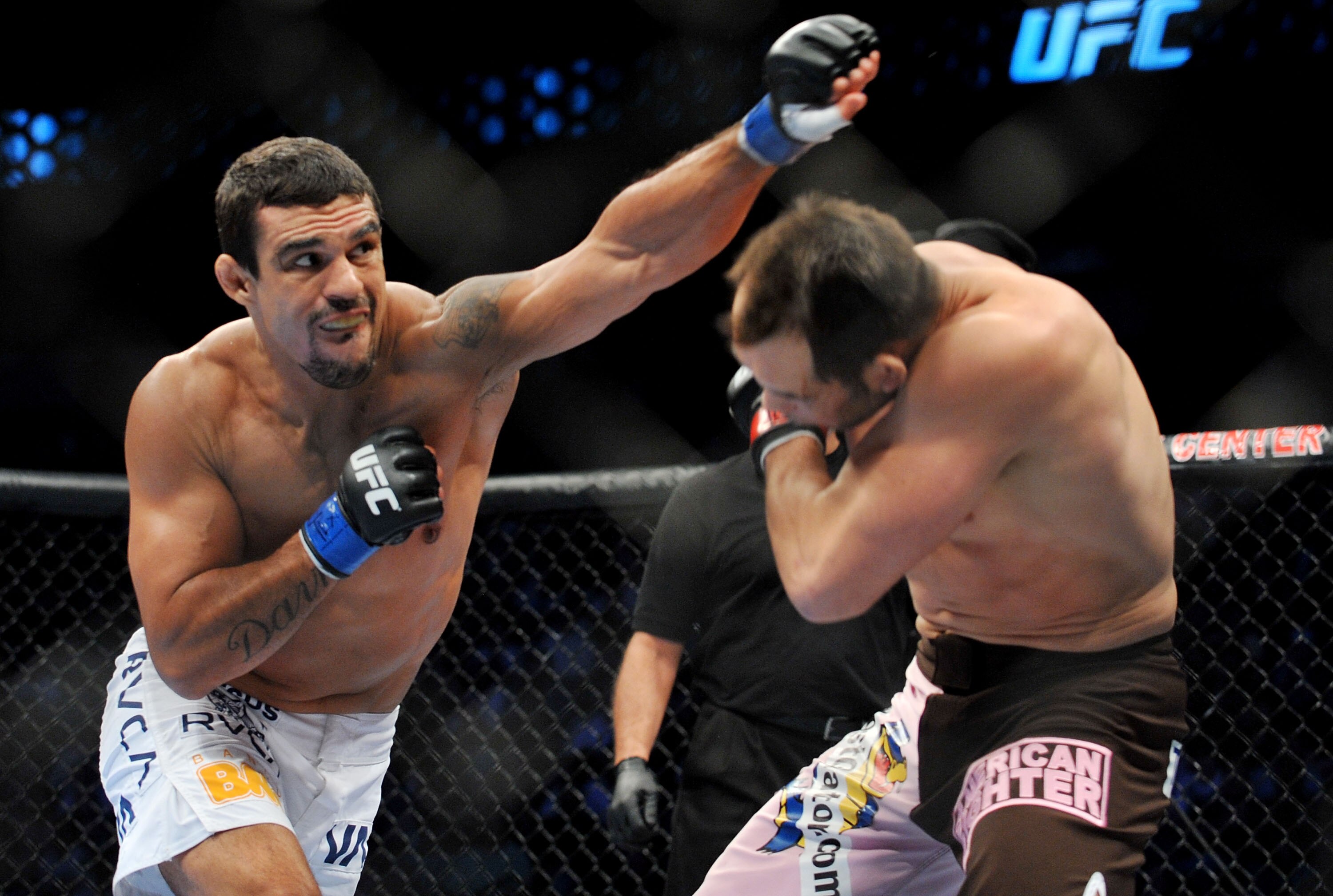 DALLAS - SEPTEMBER 19:  UFC fighter Vitor Belfort  (L) battles UFC fighter Rich Franklin (R) during their Catch weight bout at UFC 103: Franklin vs. Belfort at the American Airlines Center on September 19, 2009 in Dallas, Texas.  (Photo by Jon Kopaloff/Ge
